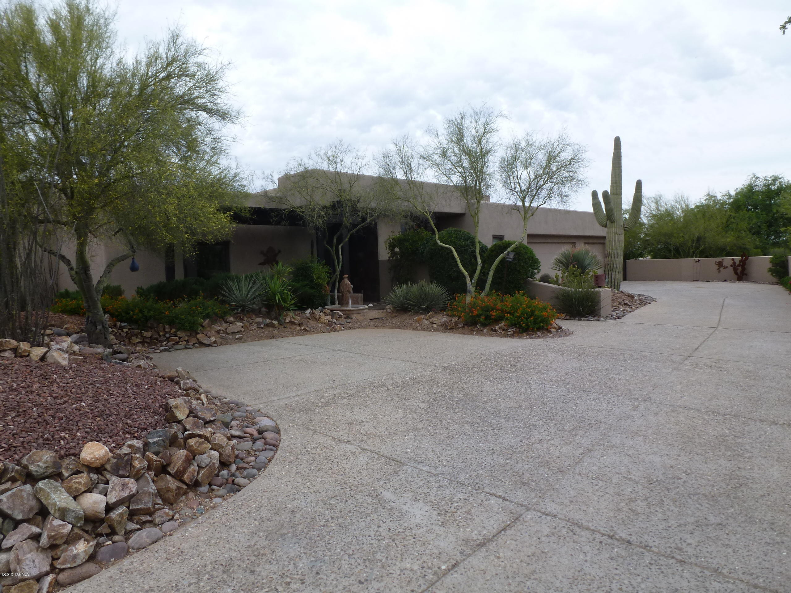 HUGE PRICE REDUCTION: SELLER MOTIVATED TO CLOSE THIS YEAR, BRING ALL OFFERS!! Breathtaking views of the Catalina Mountains & city lights from this beautifully remodeled and updated foothills home. The bright open floor plan flows from one room to the next and is perfect for entertaining with views of the Catalina’s or the city lights from almost every window. Large master suite plus 3 additional bedrooms & office that could be 5th bedroom. Kitchen and baths feature new granite slab counters, cherry cabinets & stainless steel appliances. New tile, paint, & carpet throughout. Landscaped backyard has sweeping city views, comfortable sitting areas, terrific pool, spa, & water feature. Situated in a small gated foothills community, privacy abounds on this large lot located on a quiet cul-de-s