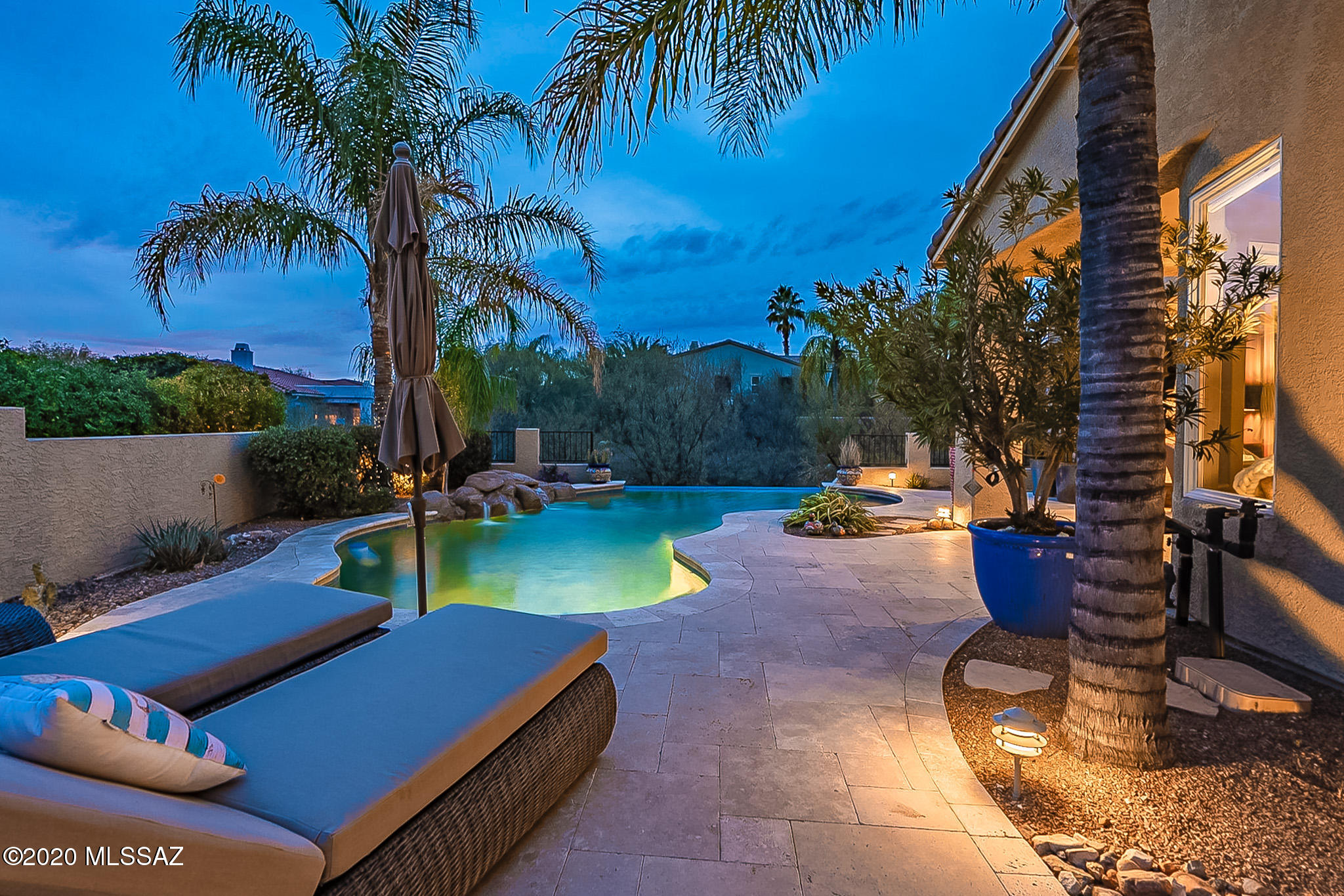 This is the ultimate entertainers dream in the heart of Oro Valley. Enjoy your commercially heated resort style pool year round w/travertine flooring, extended private patio with mesmerizing fireplace, built in kitchen, & tranquil courtyard. Complimenting this home is a 3 car garage with all the upgrades including: heating/cooling, 4 foot extension, 8 foot door, 220 amp, & cabinets. The versatility of this home is hard to come by, with 3 bdrms, one of which can be used as a casita. This room includes its own heating/cooling, private entrance, and full bath. Venture on to your vastly open gourmet kitchen where you will find expansive counter space and plenty of cabinets,  bar w/ wine fridge.  Then retire to your master en-suite w/recently remodeled bathroom.
This home home excludes luxury.