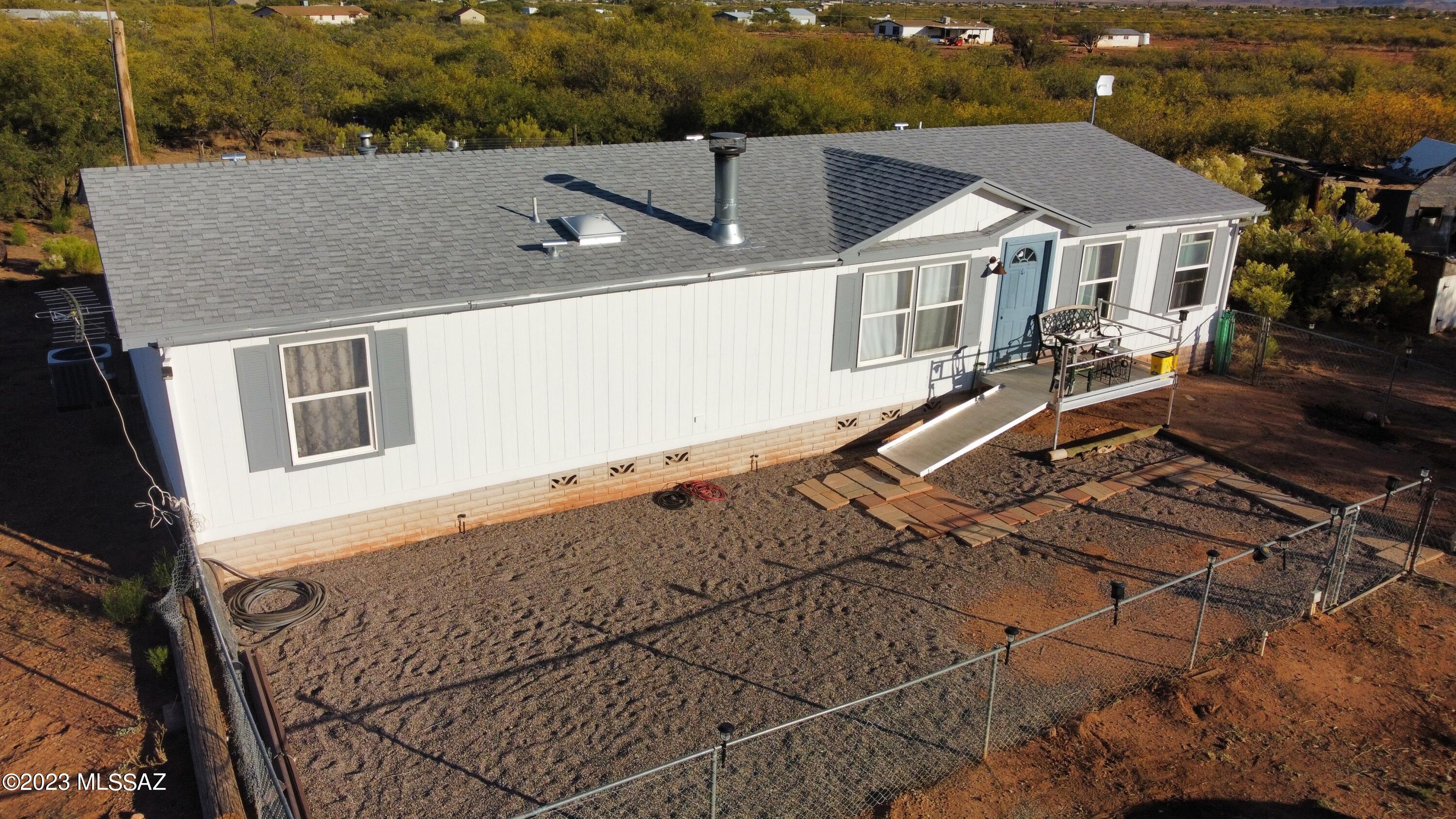 Newly remodeled manufactured home in the greater San Pedro ranches. This home has updated kitchen and bathrooms, new flooring and appliances, fresh paint and a kitchen island. This home sits on 4 acres of flat horse property with plenty of seclusion, but only minutes from Sierra Vista. Well water and septic for this property and fantastic views of the surrounding mountains. Bring your horses and animals out to this one of a kind home with 4 acres of useable land . Gated front and back areas for pets or children.