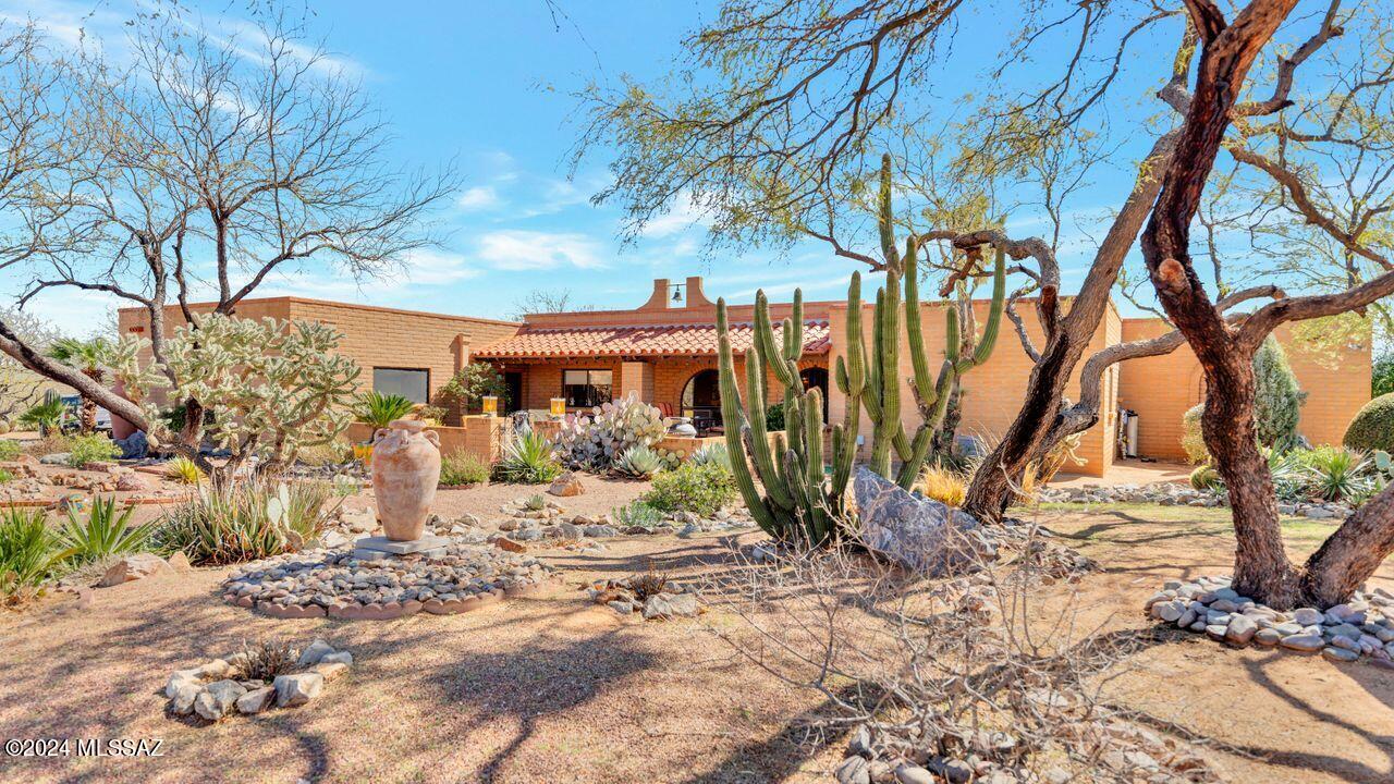 Amazing home on 2.79 acres in the Foothills. Views of the Santa Rita mountains and the prestine desert surrounds this residence. Large pool and deck area is completely walled and includes a covered patio. The property includes fruit trees and beautiful landscape decorations. There is an oversized three-car garage. Inside find the beautifully remodeled kitchen with granite counters and rare wood cabinetry. This home has 2 bedrooms, 2.5 baths and has a very large inside laundry room. Roof was  completely replaced on 09/1/2022. Is warranted thru September 1, 2037. Pool was refurbished in May 2024 and converted to "salt water" system. Pool equipment has new equipment.
