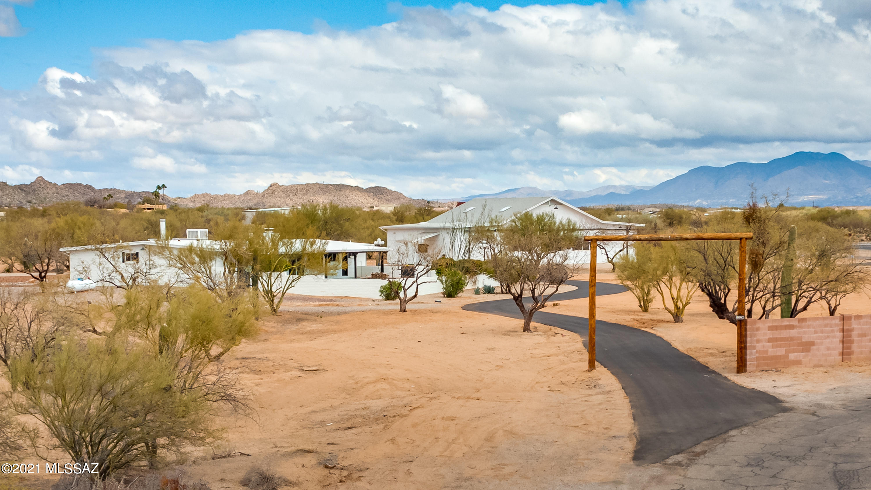 Imagine stepping out of your home, getting into your plane & taxiing onto a runway & taking flight! Rare opportunity to own at La Cholla Airpark. 2,333sf single-story updated 3BR/2½BA home+3,168sf hangar w/two workshops/office areas w/lofts+2-car garage situated on 7.23acres w/runway access & stunning panoramic Catalina Mountain Views. Offering ultimate luxury in personal air travel this remarkable fly-in/fly-out property adjacent to runway w/taxiway & aircraft parking pad, offers privacy yet close to all Oro Valley amenities. Rich in character Authentic Adobe block masonry construction w/newly updated rooms, redesigned kitchen, complete replumb & all new electrical throughout the property. ''A mile of road will take you a mile. A mile of runway will take you anywhere.'' Horses Welcome to Expansive hangarcan house up to 8 cars, or 2 RVs and 6 cars