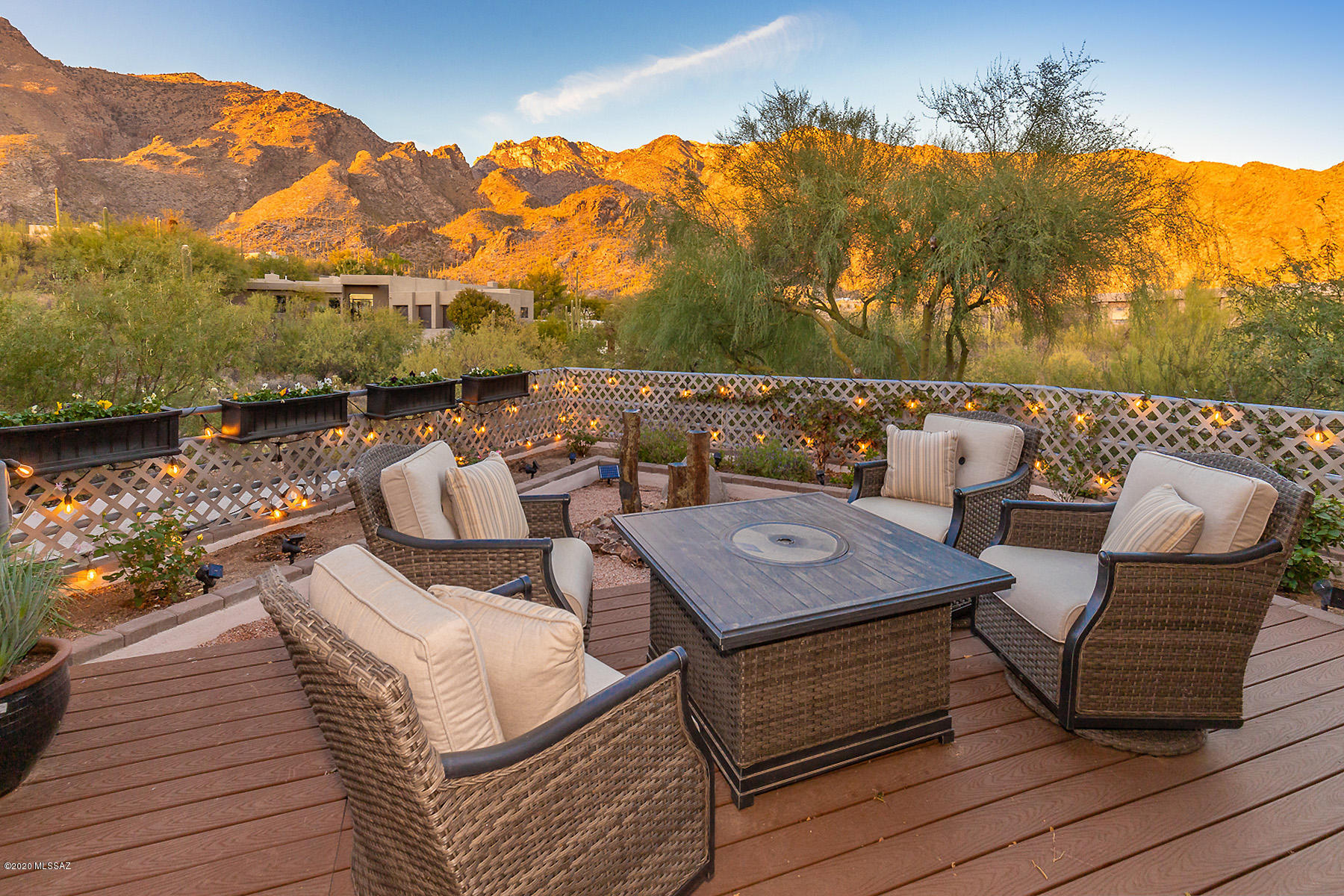 Remarkable views up Ventana Canyon from this custom contemporary on an elevated corner lot in prestigious Alta Vista.  Walls of windows and outside seating area with rock spires at entrance to the Canyon to gaze upon.  And the golden glow at sunset.  Recent updates including Davis Kitchens remodel with new island, cherry cabinetry, quartz counters, all new stainless appliances, induction cooktop, new ceramic flooring.  Living room adds more views, with new Brazilian pecan flooring, and dramatic fireplace with stacked stone surround.  Bonus room and den/office.  Expansive backyard with terraced grass play area, trees, raised gardens, and city lights.  New A/C units and roof.  Oversized 3-car garage with 220 power and 292sf exterior storage area.  District 16 schools.
