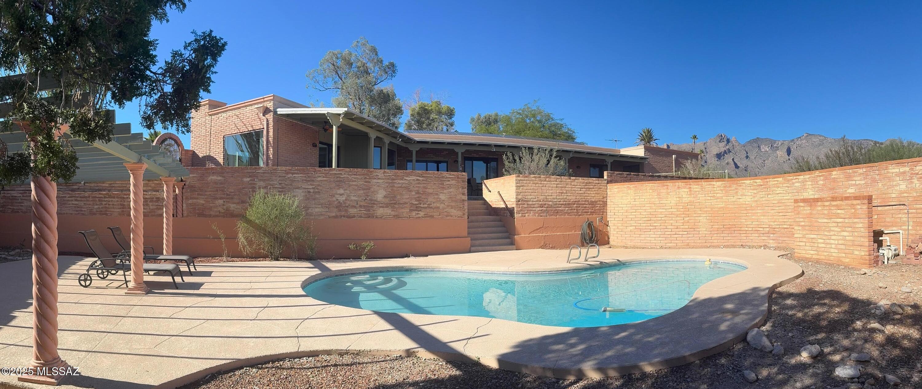 This Gorgeous Home Is In The Heart Of Catalina Foothills, With Amazing Views! There Aren't Many Houses Like This Left In Tucson, And It's Rare When 1 Comes Up For Sale. Less Than A Mile From La Encatada Mall (Walking Distance), On Over An Acre, With 4-Car Garage & Plenty Of Parking. The Sellers Took Great Care Of This Home, And Just Updated The Entire Kitchen & Flooring. The Front, Back, And Side Yards Are Super Private, And There Is Tons Of Space For Entertaining. There's An Electric Vehicle Charger & Fully-Owned Solar System (With An Average Electric Bill Below $40/mo). The Location, Views, And Home Make This 1 Of The Best Houses Under A Million!