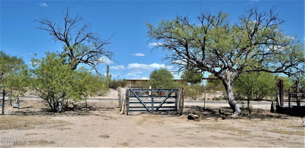 Looking for Horse Property? This 2.61 Acre Parcel has an roping arena and corals that needs some TLC. A person with a vision could turn this property into a horse lover's paradise. Come check it out today and imagine the possibilities. There is also a 480 sqft studio on the property that is sold AS-IS. Septic and studio sold AS-IS