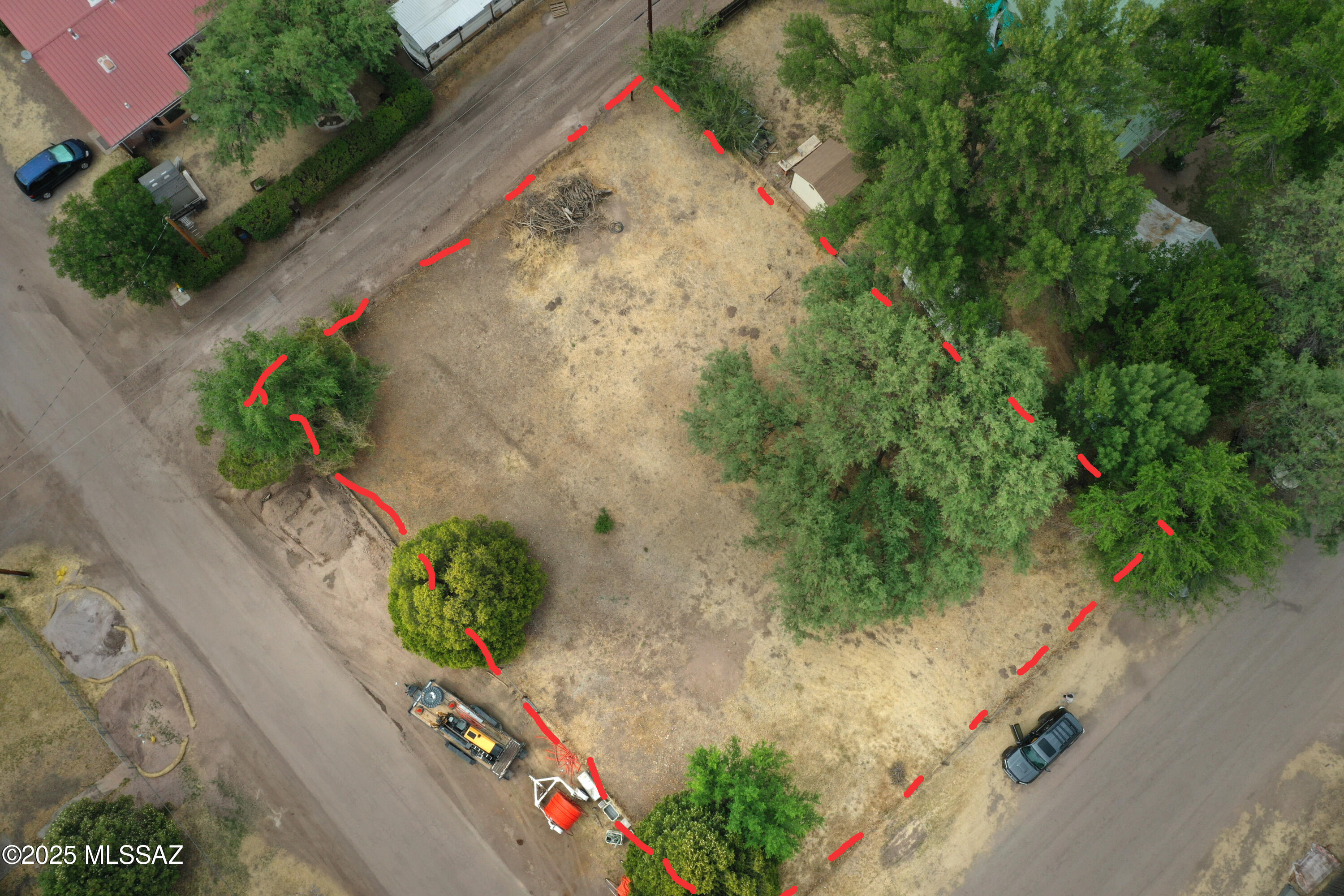 Wanting to build a special home (or homes) in historic Patagonia? If so, it will be difficult to secure a more central setting that's also surrounded by vintage homes & on the way to Paton's hummingbird center! You'll easily walk to all Patagonia amenities & features. This land offering is actually 2 full Patagonia Town lots that have each been formally Surveyed & legally divided. They're now 4 buildable sites, each with its own  Assessor's Tax # though offered here in one single purchase. Later, you may decide to use it as a single homestead OR 4 homes! The property includes a grandfathered PRIVATE WELL & ARCHITECTURAL DRAWINGS for 4 small homes should you care to use them. Utilities, including the private Well, are near the lot lines. A super opportunity with many interesting options.
