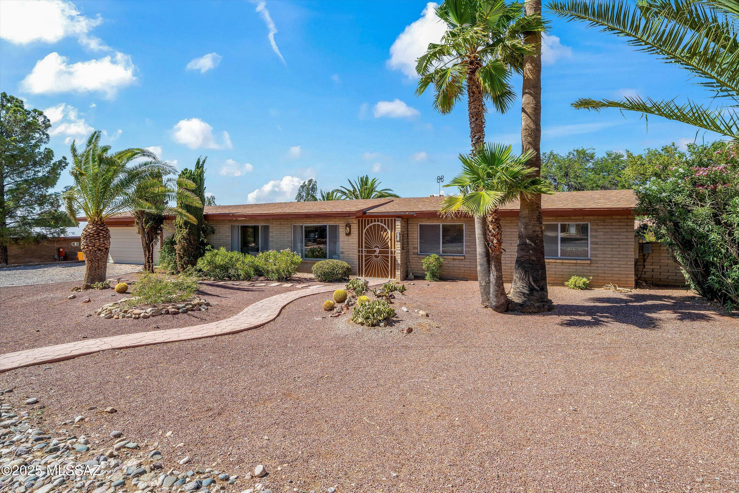Fixer-upper with major potential in Corona de Tucson! This 3BD/2BA home features granite kitchen countertops, updated cabinets, a cozy fireplace, AZ room, hot tub room, and an extended garage with covered storage in the back. Updated roof, & fresh pool equipment! Spacious backyard. Located in the desirable Vail School District! *Home to be sold in as-is condition*
