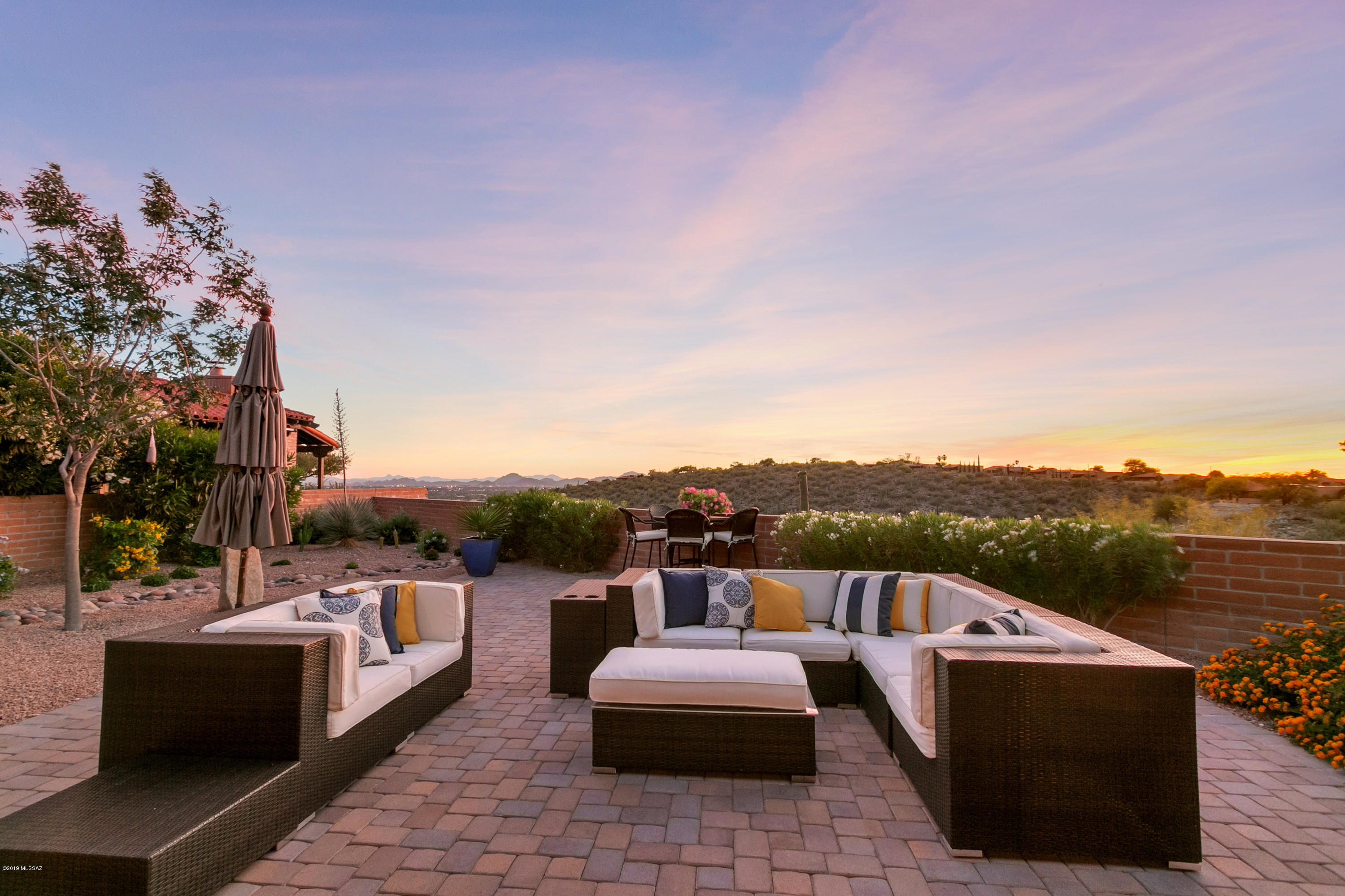 FAIRFIELD LIVING: Spot on Mountain & City VIEWS YOU'LL NEVER WANT TO LEAVE.  Watch fireworks all the way to A-Mountain while living in the heart of the Foothills. Newly remodeled town home with 2 Bedrooms, 2 Bath + den - just shy of 2,000 sq ft.  Everyone loves an open concept floor plan - and this one will not disappoint. Upgrades are to many to list ..but here's a few to make you want to rush right over -  gas fireplace, cathedral ceilings,  24'' porcelain tile throughout, new exterior & interior paint, custom cabinets & granite in kitchen, baths & the fun/funky wet bar, SS kitchen appliances, gas stove, & under counter sinks.  Owners added huge side patio w/ sliders off kitchen.  Over 15k spent on custom blinds & the icing on the cake is the 30k spent on remodeled back & front yards.