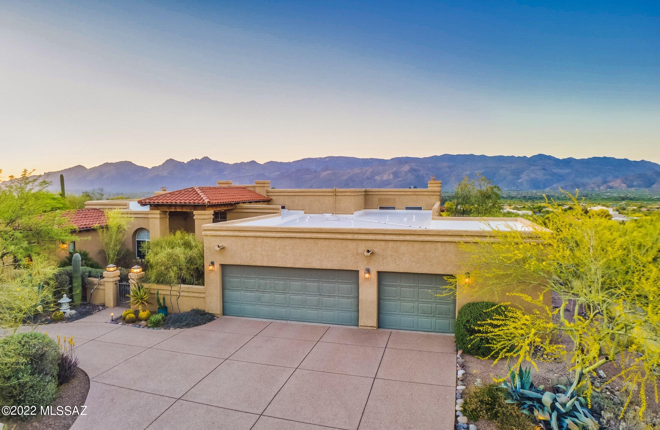 POOL + VIEWS! Spectacular Desert Oasis Property on 3.31 acres with Priceless Catalina and Rincon Mountain Views. This immaculate Home features 4 bedrooms, 2.5 bathrooms, 2 separate living rooms, 1 private office, 1 dining area, 3.5 car garage and a breath-taking custom private back yard with pool and jacuzzi for resort-style living all year round. This home is on a gated private dirt road. NO HOA!