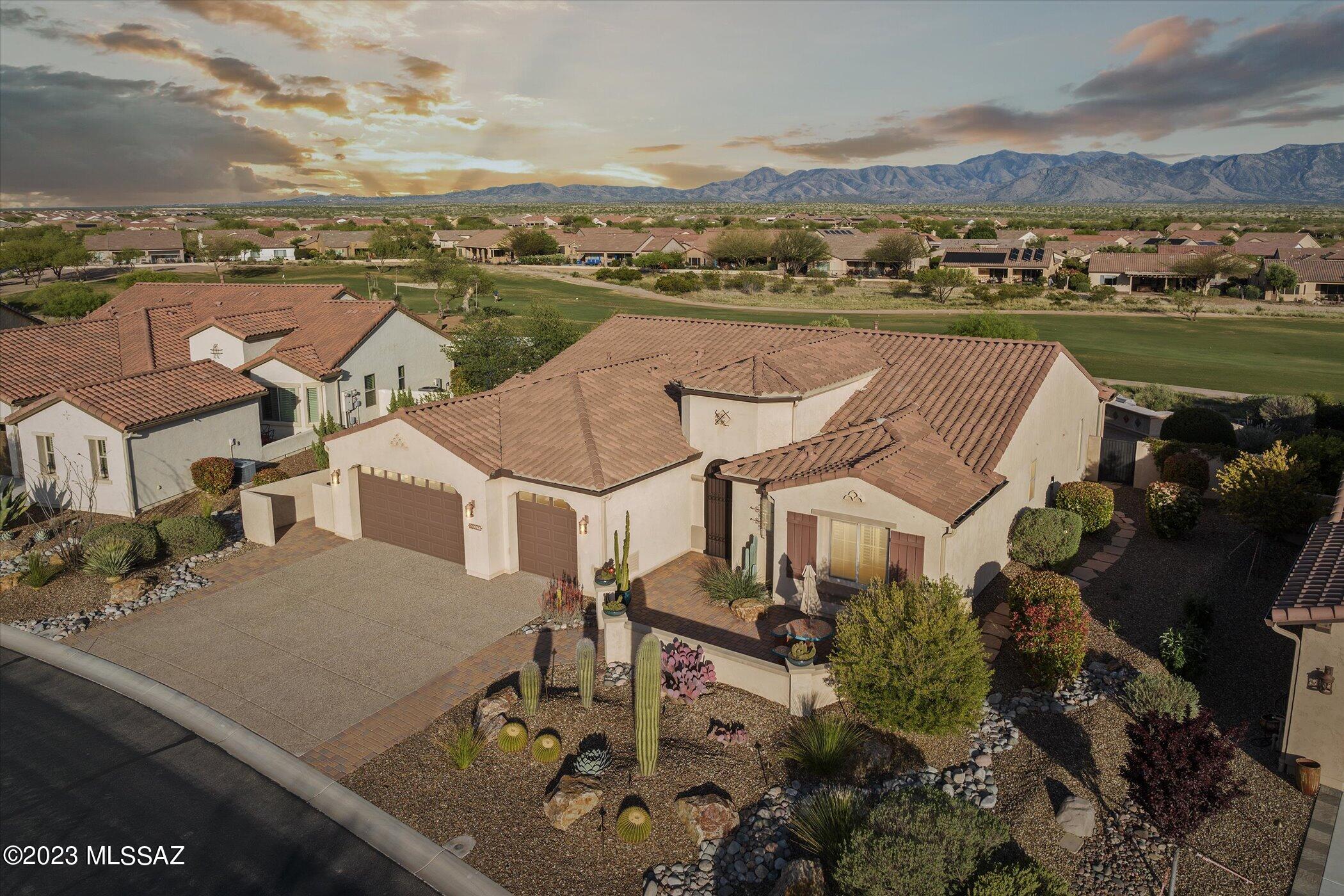This stunning 180 degree panoramic mountain view will capture your breath as you enter into this exceptionally upgraded contemporary 2,603 sf Tessoro model built in 2015. Beautiful extensive landscaping, front courtyard & privacy on one of SaddleBrooke Ranch's best premier lots! This two bedroom with Large den/office plan is designed in a warm color palette that possesses calm & tranquility. Great room concept leads to an exceptional kitchen that offers beautiful granite counters, GE Monogram series stainless steel appliances, island w/sink upgraded cabinets w/pulls, tile backsplash & soft close cabinets & drawers. Spacious family RM has dry bar w/ wine cooler. Master suite is spacious & master bath w/upgraded super shower, dual vanity w/make-up area, quartz counters & walk-in closet...... ...... Guest bedroom has it's own bathroom w/tub/shower & walk-in closet. Den w/double glass doors. Private backyard is a true sanctuary w/covered patio, extended large ramada, rolling patio screen, professional landscaping, calming fountain & some of the best views in the community. 3 car, 4' extended garage-epoxy floors. Tile throughout home, NO carpet. Laundry room w/cabinets & washer & dryer convey. Why wait to build when you can move right in and start enjoying life on the ranch! SBR provides exceptional 55+ living, an abundance of first class amenities!.