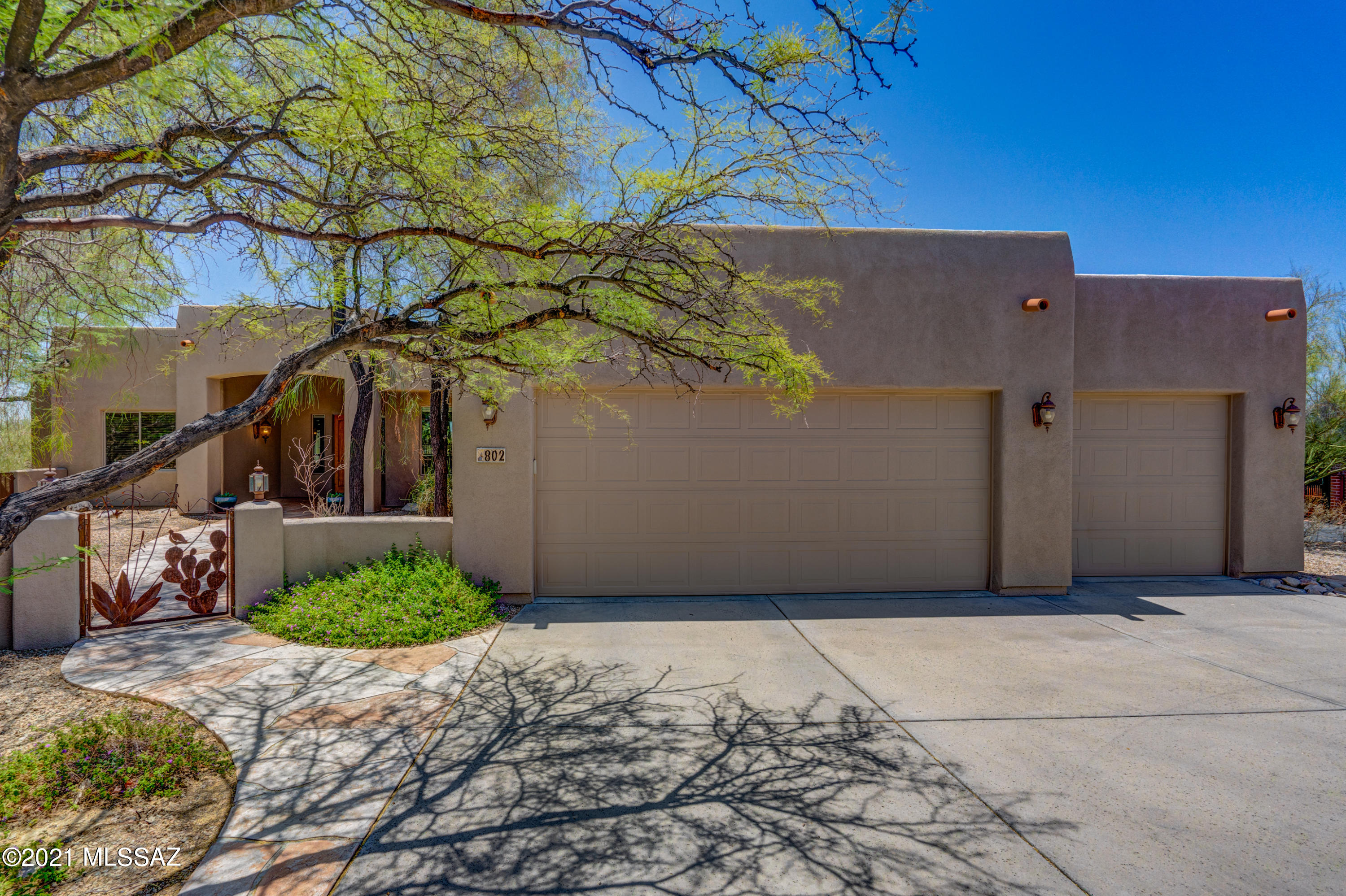 Custom 4BD/3BA (3,068 sq ft) estate on over a half acre boasts indoor/outdoor living spaces plus panoramic mountain/city light views. Charming gated courtyard leads to an impressive foyer w/ Travertine inset tile and pillars flanking the living & dining rooms. Beyond lies an expansive Great room w/ view windows and media wall w/ fireplace. Gourmet kitchen hosts quartz countertops, stainless appliances, work island and breakfast bar. Master suite offers a luxury bath with jetted tub and walk-in shower. Fourth bedroom can be office. Bedrooms 2 & 3 share a Jack N Jill bath. Hall bath has shower. Fabulous outdoor living room with massive fireplace and BBQ station offers a shaded pergola spanning length of home. You'll also enjoy a heated saltwater pool, easy care turf, mature trees and views.