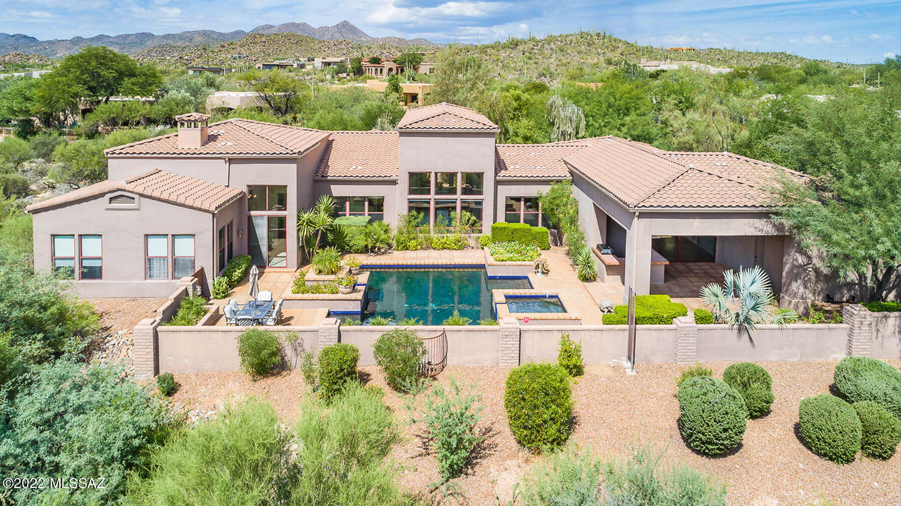 Strikingly beautiful 4BD/4.5BA custom estate in prestigious gated Honey Bee Canyon Estates boasts mountain views. Travertine flooring abounds in this 4,860sf home with architectural detail. Impressive courtyard flows to a grand foyer leading to formal living & dining rooms w/hardwood floors and tall view windows. Great room w/FP opens to sleek gourmet kitchen w/quartz counters, Sub-Zero fridge, Viking double oven/6-burner stove plus dining nook. Retreat to the Owner's Suite w/sitting room, 2-way FP and luxury bath w/dual vanities & walk-in closets, jetted tub, walk-in shower. Two ensuite guest rooms (one off courtyard), Study/4th bedroom, powder room, large pool bath and 4-car garage. Retreat to a fabulous rear yard w/huge BBQ island plus heated saltwater pool w/raised spa. Views!