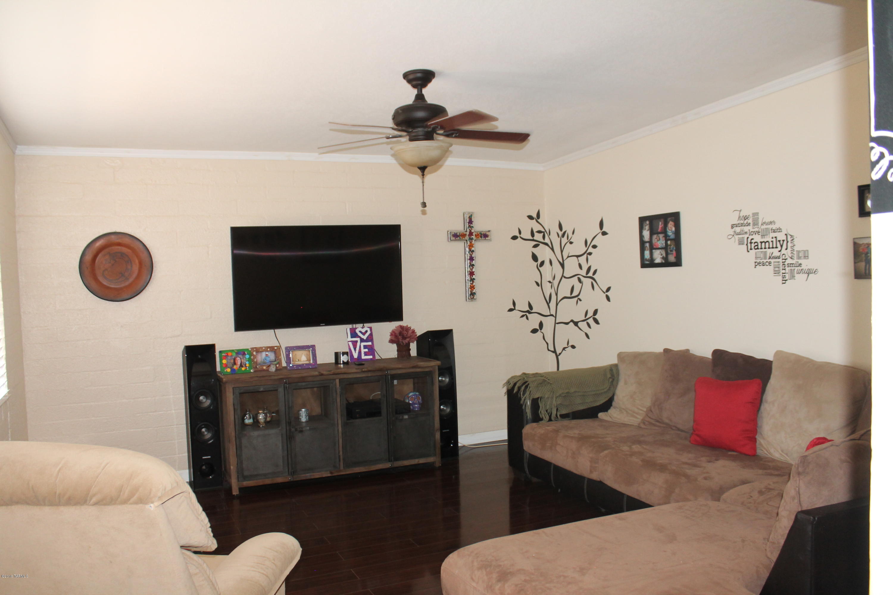 Wonderful upgraded home on large lot. Great room with wood like floors, newer kitchen with tiled floors, 3 bedrooms, a/c and newer roof. Great walled back yard, perfect play area for kids and  room for boats etc,  This is a great home. Do not miss. This is in the city and should qualify for Pathway financing.