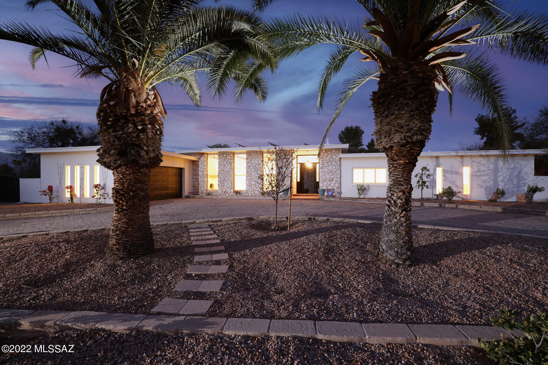 Fall in love with this stunning contemporary resort style home located in 24 hour Guard Gated Tucson Country Club Estates!  This 5Bed/3Bath gem is an entertainer's dream and boasts a tennis court, sparkling pool with lounge area, ramada, built-in gas fire pit and outdoor kitchen.  Lounge by the pool and enjoy incredible unobstructed views of the Catalina Mountains within a private backyard with no neighbors on either side. Gourmet kitchen adjoins great room and includes granite counter tops, oversized professional fridge, 6 burner gas range, and double ovens.  Once you visit this home you will never want to leave.  House has owned solar panels, new flooring throughout entire home, and is newly painted inside and out.  Every inch has been updated and immaculately maintained.