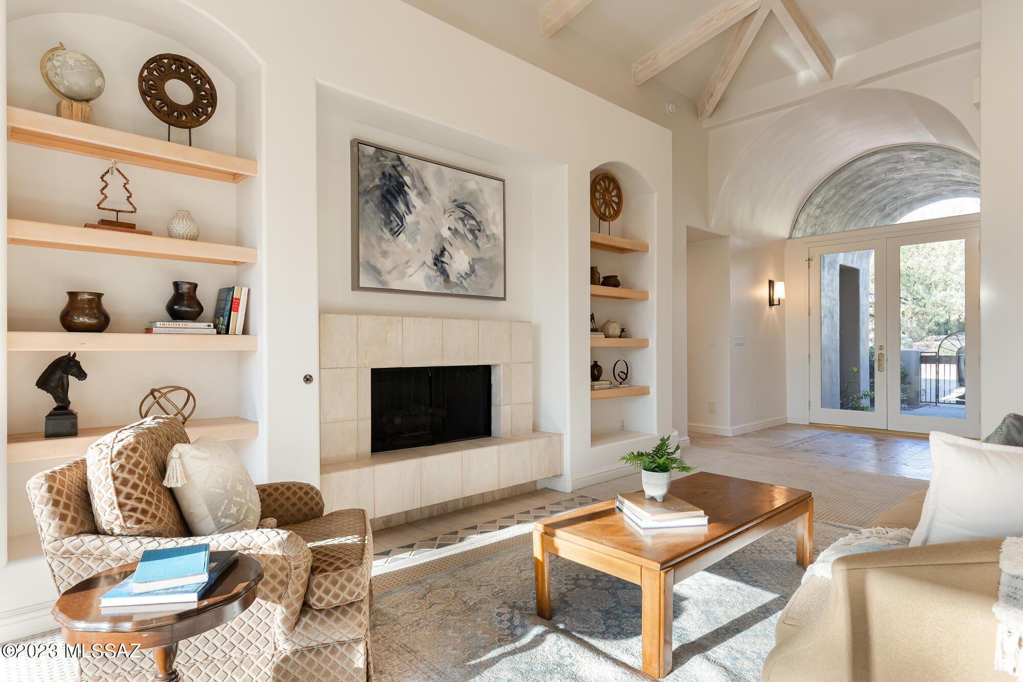 Enjoy the serenity and privacy of this single story custom home just minutes to Sabino Canyon. Vaulted ceilings with beamed details and Two fireplaces make this home a cozy retreat. The large open kitchen with gas cooking and island overlooks the family room with large windows to enjoy the Sonoran desert views. Multiple sliding glass doors take you to expansive patios which surround the pebble tech pool and spa. The primary suite has multiple closets, a gracious bathroom with spa tub, separate toilet, and dual vanities. Three additional bedrooms, two bathrooms, and a large laundry room complete the split floor plan. Three car garage, no interior steps, and a brand new tile roof. Proximity to hiking, golf, restaurants and Catalina Foothills schools make this home a perfect fit for year round living or seasonal visitors.