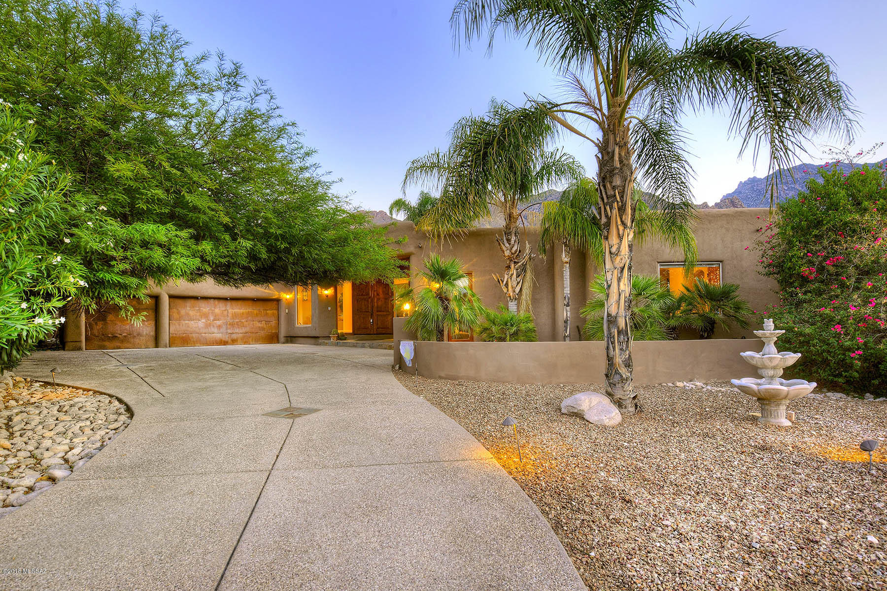 CHECK OUT THE VIDEO TAB. Outstanding Home Architecturally & Aesthetically pleasing w/wood ceiling, decorative columns, unique fireplace, ceiling fans, travertine floors, upgraded lighting, lots of large windows. Stunning gourmet kitchen features center island, granite counters SS Viking appliances, desk area, & plethora of upgraded cabinetry with stylish hardware. French door to patio from family room w/fireplace, and built-in media shelves. Romantic fireplace in master retreat with patio access, coffered wood ceilings, window seat, private en suite w/jetted tub, and custom walk-in closet. Generous size bedrooms, ample closets/storage, large laundry room w/utility sink, and 4 upscale baths. Breathtaking Mountain Views, sparkling pool, exterior fireplace. AC replaced in June.