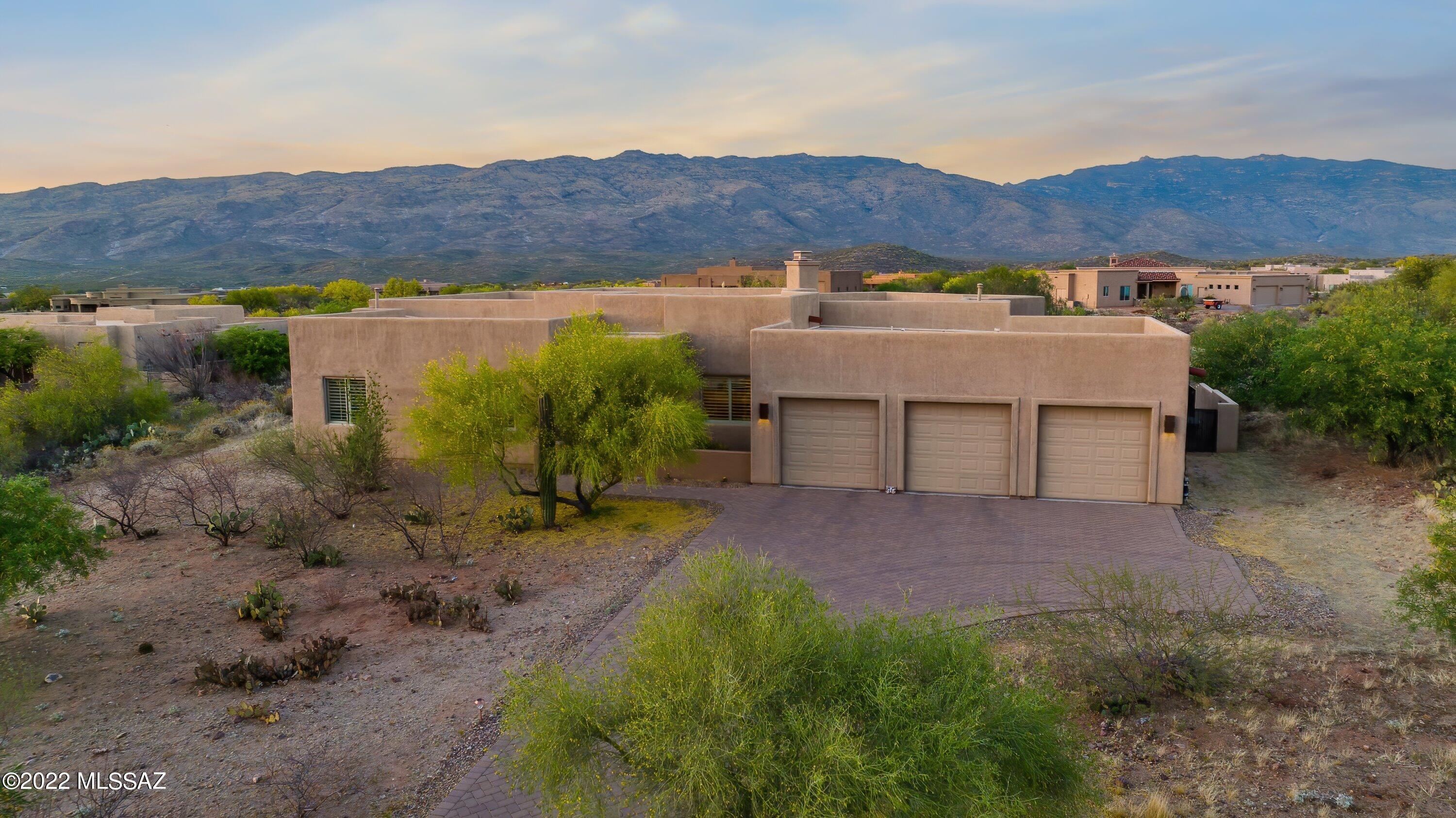 Gated Coyote Creek! Stunning views! This thoughtfully designed home built by CHT Homes is situated on 1.23 ac. with stunning views of the Rincon Mountains. A beautiful 4 bdrm, 2-1/2 bath, 3155 sf with all the upgrades you would want! Open floor plan, see-through FP in Great Room and Family Room. Lots of windows, amazing natural light, planation shutters, formal dining room, Spacious Kitchen with granite counter-tops large center island and Breakfast Bar, Stainless Appliances which convey. Custom Maple cabinets through out.  Extra storage in house and garage. Elegant Oversized Master Suite that is bright and cheery with gas FP. The Master Bath includes maple cabinets, travertine flooring, double vanity counter-tops and walk in shower. Many
Smart Home upgrades and wiring.