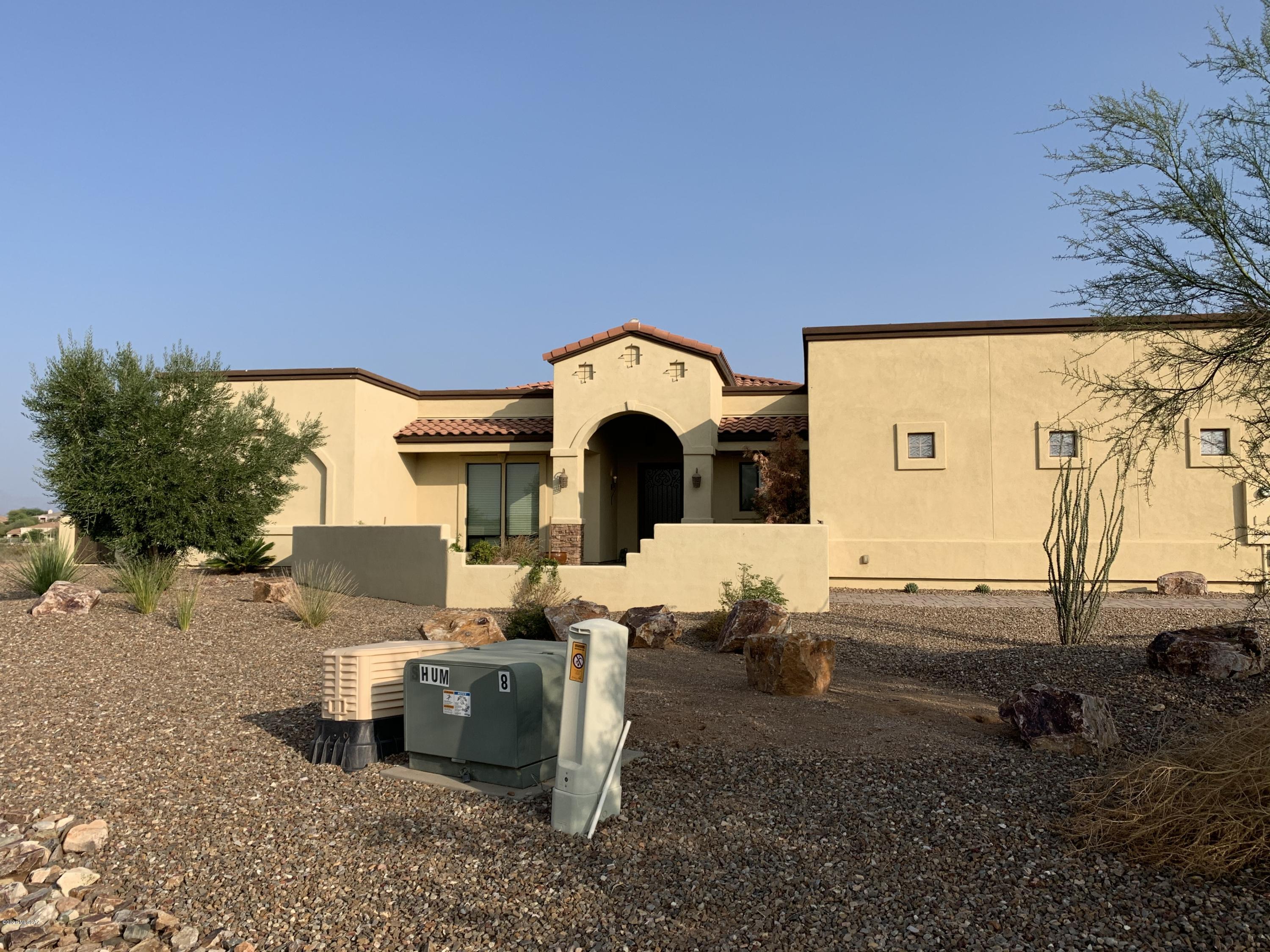 Pride of ownership & attention to detail make this the perfect home to weather the Covid-19 pandemic. Movie theaters & pools are closed but don't you worry. This stunning home has a theater room, sparkling pool, den/gym, outdoor kitchen w/natural gas and oversized covered porch with unobstructed views of the Catalina mountains. Multi-gen living needed?  No problem, there is room for a casita. Chef's kitchen w/double islands, breakfast bar, double ovens, prep sink, solid slab granite, farm sink & walk in pantry. Split bedroom floorplan provides the privacy you desire. Master suite boasts executive height double sinks, jetted soaking tub, walk in shower & oversized master closet with custom cabinetry. Large laundry room with cabinetry and room for fridge & freezer. Oversized 3 car garage.