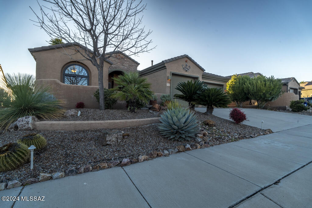 Home on the 9th hole offers mountain, water, and golf course views from almost every living area inside. Extensive covered and open patios. Outdoor oasis has hot tub, fire pit, water feature, built-in BBQ, and new irrigation system in front and back yards along with orange, lemon, fig, pomegranate, and cumquat fruit trees! Control the cafe lights on the custom wrought iron shade on the extended patio, park the truck in the 4' extended garage with built in storage cabinets. Enjoy the butler's pantry and tile flooring throughout the spacious rooms and bedrooms. With all new  Renewal by Andersen windows, owned solar and so many other new elements, you don't want to miss this one. Please see our features list!  Come experience the awesome lifestyle that awaits.