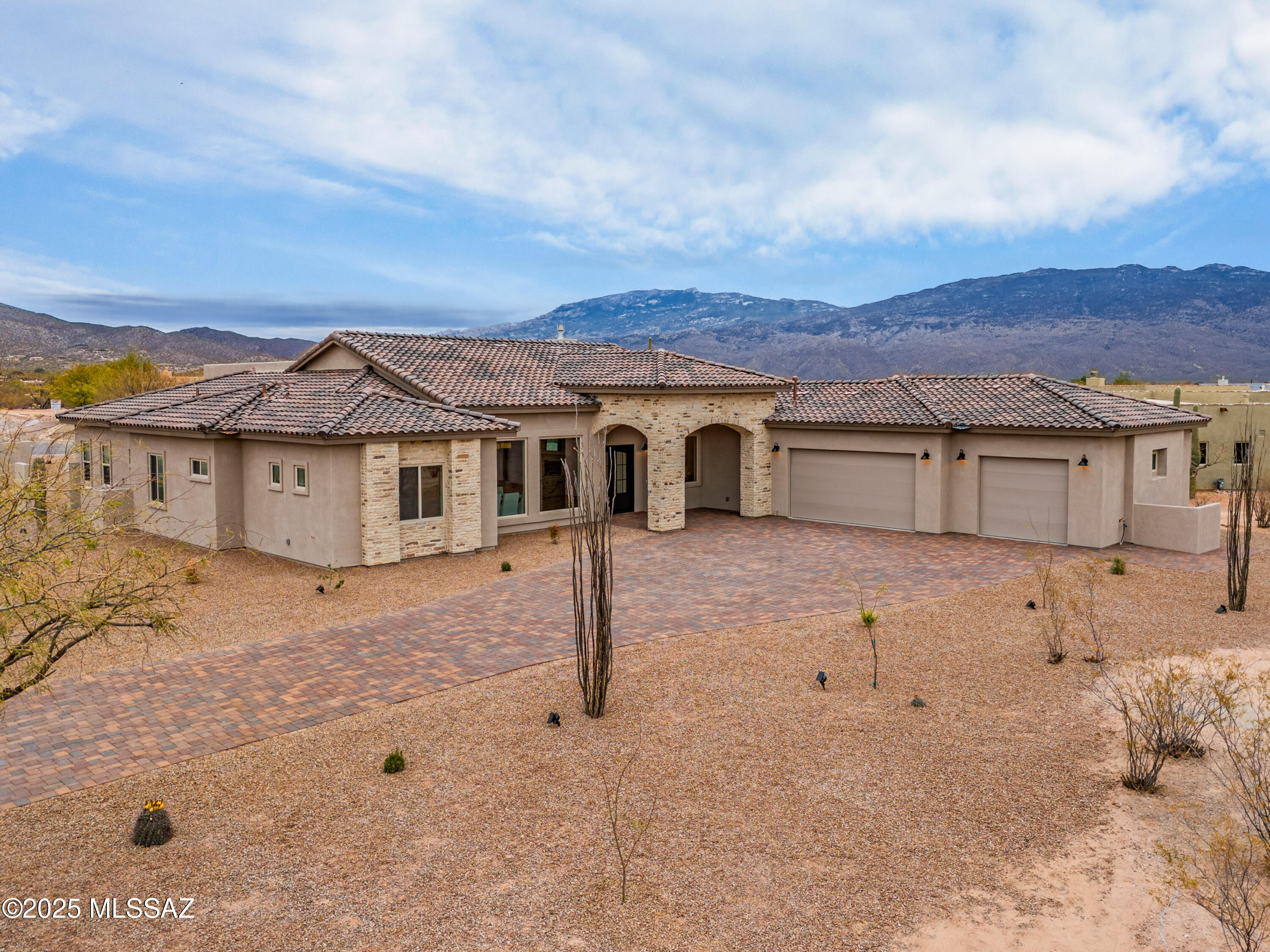 Elegant 4 BR/3.5 BA Rancho Soldados home with comfortable great room living and large 3-car garage in the heart of the desirable neighborhood of Rancho Soldados! Well planned floor plan with private office, secondary en-suite bedroom with walk in tile shower, owner's suite with marble floors including large walk in shower and stand alone bathtub, expansive dining room, and stunning mountain views. Kitchen features oversized island with quartz countertops, ample storage, and a Butler's Pantry. Exterior elevation was carefully designed with stone entrance, paver driveway and metal double entry doors! All within the award winning Tanque Verde School District. New Construction and ready to move in!