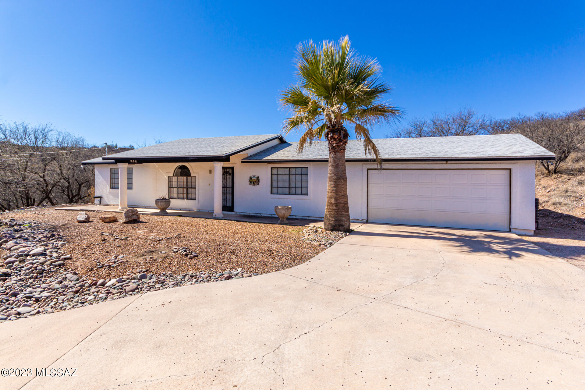 This Rio Rico home has been updated and sits slightly secluded from the main road to offer some privacy on over an acre of land. The Home offers Newer HVAC and roof (2018), Termites treated with Lifetime warranty. Water softner (2020). New hot water heater (2022). Remodeled kitchen with solid wood cabinet doors and drawer fronts, pantry, new quartz countertops, tile backsplash and stainless steel appliances. Remodeled master bath offers a shower, new vanity and floor tile, second bath has new Porcelain over steel in the bathtub, vanity and floor tile. Two car garage with fully fenced back yard.