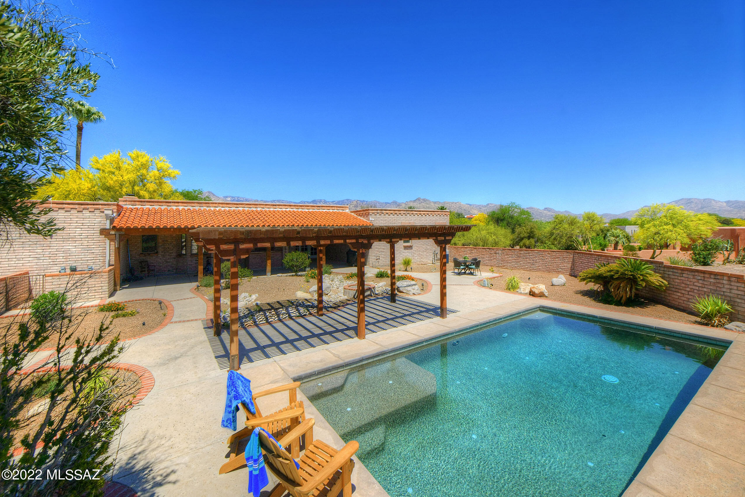 Check out this gem in highly sought after Hacienda Del Joven Estates!   This gorgeous 3 bed/3 bath home is just what you've been looking for, with its resort style backyard with self-cleaning, solar-heated pool, built-in bar, poolside gazebo, huge covered patio and built in firepit.  Home is located on a huge, lushly-landscaped, corner lot, boasting amazing mountain views.  Open concept kitchen features granite countertops, stacked stone accents, stainless appliances included, and build in breakfast nook.  Recent seller upgrades include two new high efficiency Lennox GOLD HVAC systems (20 and 19.5SEER), Water Conditioner and RO system.  Spacious master bath includes double sinks, jacuzzi tub and separate walk in shower. Additional features include tile and laminate flooring, central vac, security cameras, double pane windows, high ceilings, custom cabinetry and so much more!