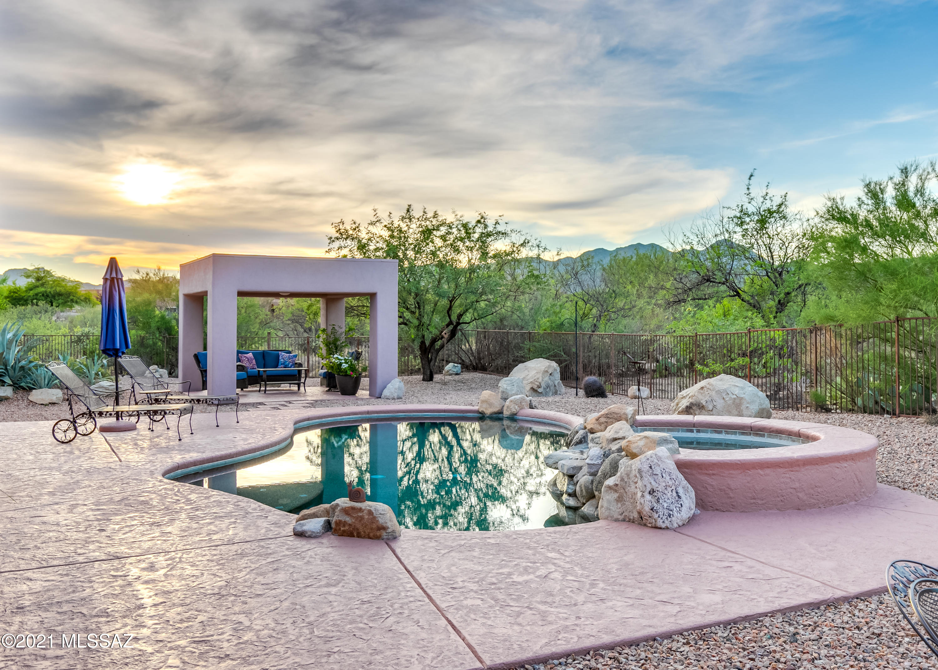 Perfect one-owner single-story 3,152sf home situated on premium lot w/Gorgeous Tortolita & Catalina Mountain Views in the gated Vistoso Highlands community in Rancho Vistoso. 3BR/2½BA +enormous game room. Inviting courtyard w/custom gate & fountain. Kitchen has Granite Counters, 40'' Cherry Wood Cabinets w/Slide-Out Shelves, Custom Travertine Backsplash, Double Wall Ovens & Electric Cooktop, Extra Large Curved Island w/Prep Sink & Breakfast Bar Seating & Casual Dining Area w/Mt Lemmon views. Custom game room Designed for Big Screen TV & Pool/Ping Pong Table, Full Wet Bar w/Seating for 4, Cherry Wood Cabinets & Built-In Refrigerator, Bose Surround Sound System w/Remote. Spacious Master Suite w/Custom Walk-In Closet w/Island Cabinet & Shelving, Oversized Glass Shower & Separate Luxurious tub & Large Sliding Door to Back Patio. Expansive .47 Acre Cul De Sac Lot w/Xeriscape Water-Free Landscaping. Covered Back Patio extends the Entire Length of the Home, Sparkling Pebble Tec Salt Water Heated Pool w/Spa & Waterfall, Beautiful Ramada w/Ceiling Fan & Light, Built-In Natural Gas BBQ Island w/Bar Seating for 6, Wood-Fired Pizza Oven. Natural Gas Fire Pit, Large Putting & Chipping Green w/Concrete Table & Benches. Spacious 3 Car Garage w/Built-In Cabinets.