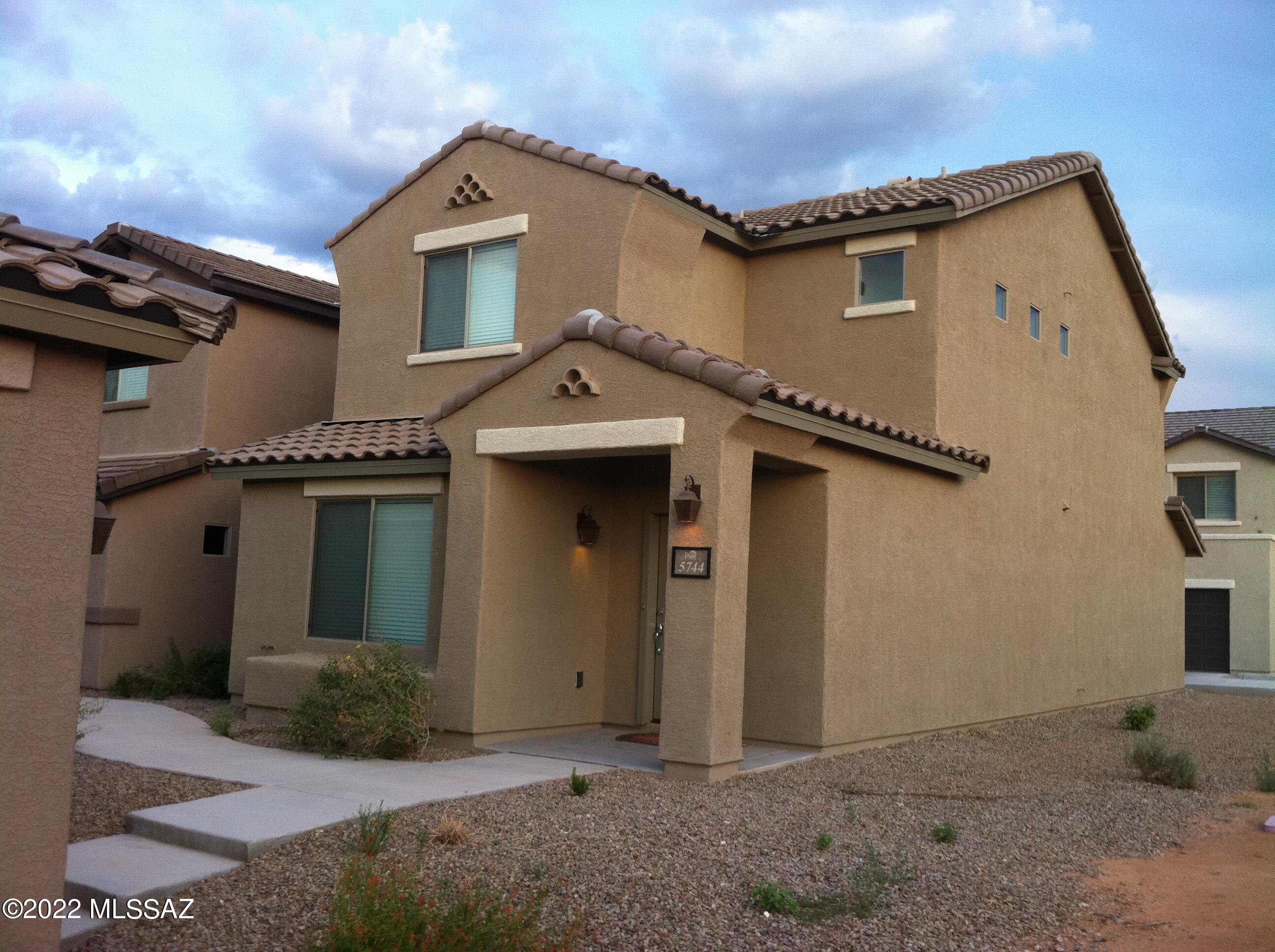 Wonderful 2br/2.5ba home near Davis-Monthan Air Force Base! downstairs all tile with powder room. Kitchen features a breakfast bar with all appliances included, upstairs boasts 2 spacious bedrooms, washer and dryer included. A/C, 2 car attached garage, Access to Community Pool!