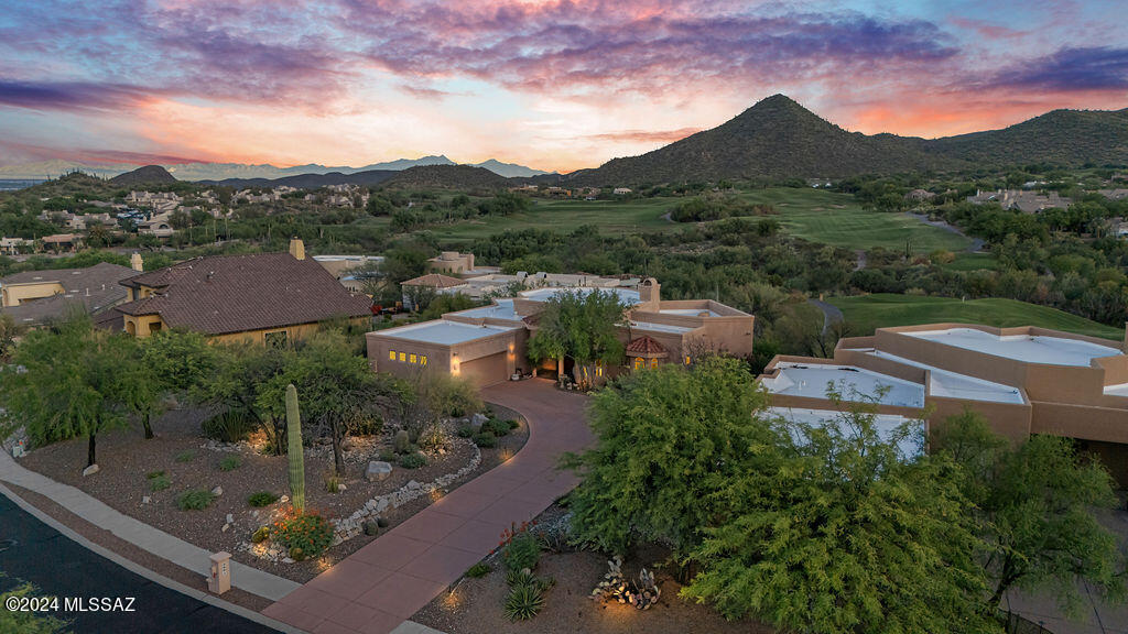 Beautiful Golf Course home located in Starr Pass. This 3 bedroom, 3.5 bath home has a large den which would make a great home office. Entry level is on the ground floor with the master suite/bath, walk-in closet, kitchen, den, living room & dining room. Downstairs level has 2 full bedrooms with their own full bathrooms & private patio. Off the living & dining rooms is a wrap-around covered patio with sweeping views of the golf course, Marriott Resort & Tucson Mountains. The kitchen is a chef's dream, with lots of counterspace & storage. Enjoy beautiful sunsets & panoramic views from most rooms of the home. Owners have the option to join the Troon Golf Course & Marriott Lifestyle Club that allows you access to the pools, lazy river, luxury spa, tennis, fitness centers & on-site restaurants