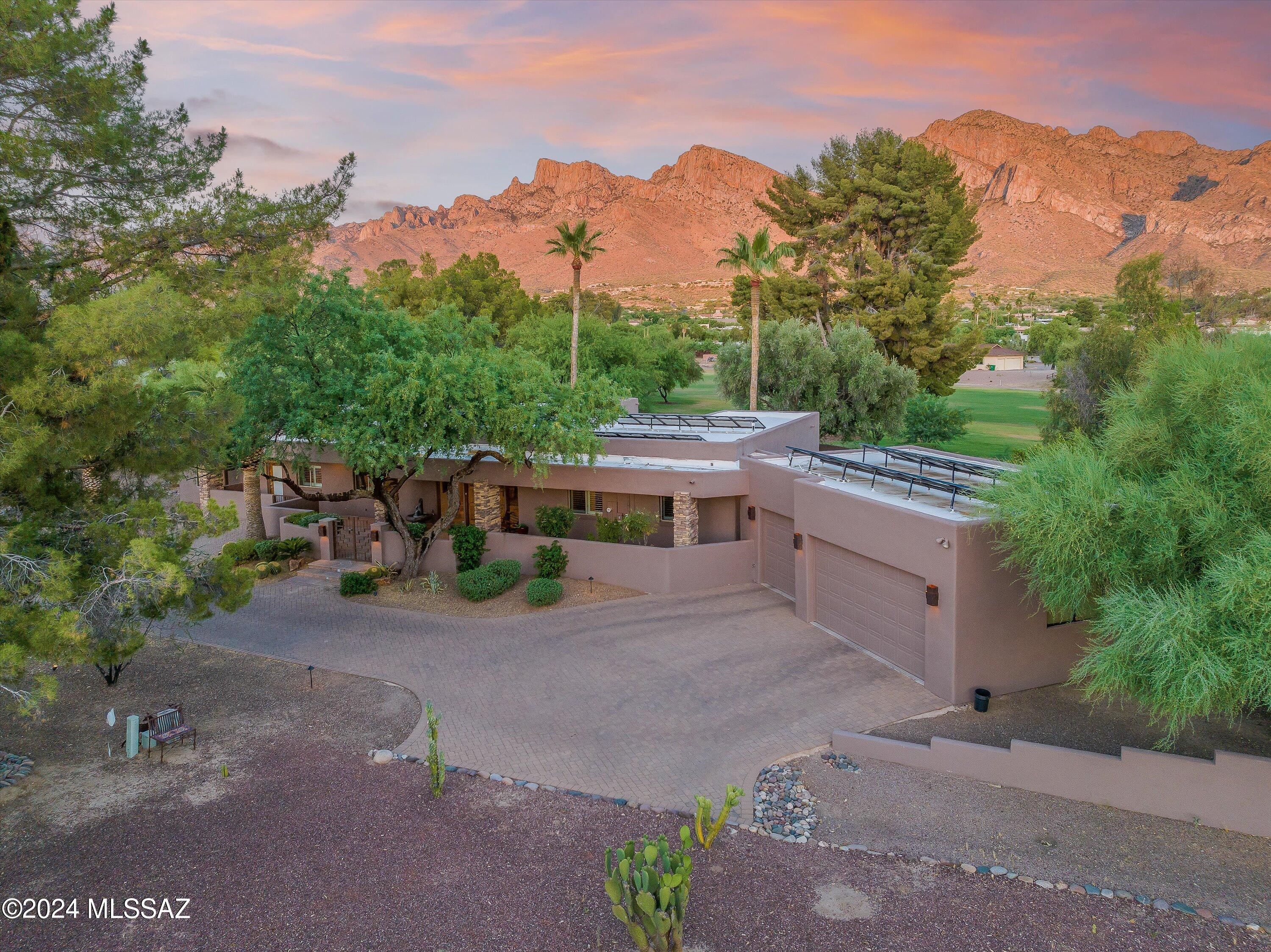 Nestled on the 6th fairway in the highly sought after Oro Valley Country Club Estates with an incredible view of Pusch Ridge, resides a beautiful and well cared for home. This 4 bed, 3 bath, 3 car garage, split floor plan home has two owner suites, and a PRE-PAID solar lease that eliminates over 90% of the electric bill. This beautiful home features alder doors throughout, travertine floors, a spacious kitchen, a great room with soaring ceilings and large windows that offer a lot of natural light and beautiful views of Pusch Ridge beyond the entertainer's super cozy backyard. Cool off in the pebble tec pool, hang out around the natural gas firepit, or relax under the expansive covered flagstone patio and watch the mountains change colors at sunset. It's a rare opportunity to own a home that sits on 3/4 acre, on a golf course lot, positioned to showcase Pusch Ridge as it does. This is the one your clients will remember.  Listing agent and sellers are related.