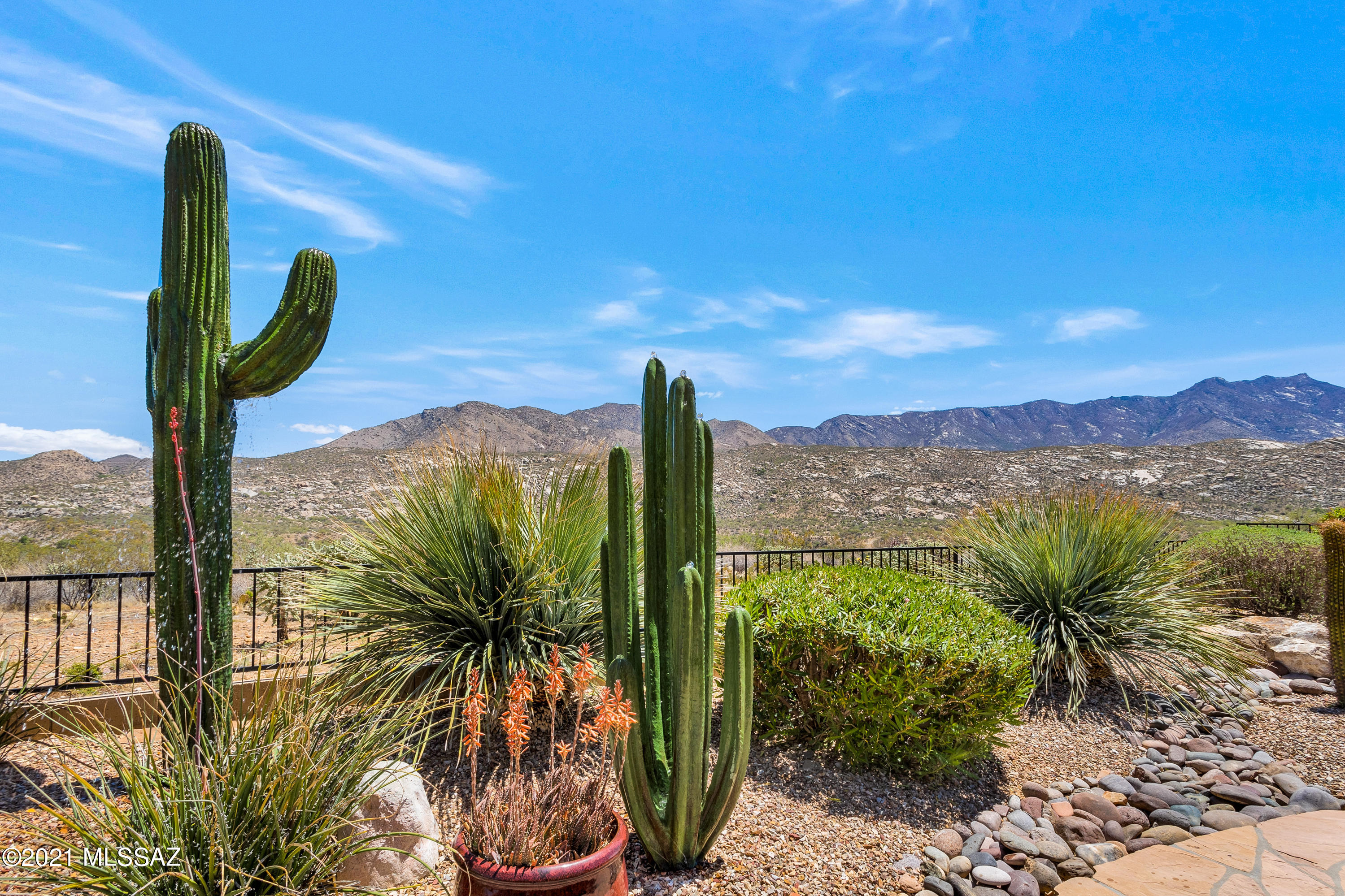 We're Proud to Present an Upgraded Santa Fe Dakota with Attached Guest House, Owned Solar & Panoramic Mountain Views. This 4 Bedroom / 3 Bathroom / 2,819 SF / Ext. 2 Car Garage Home is just what you've been waiting for! All windows replaced (except 2 sliders) in 2015 by Renewal by Anderson. 36 Owned (9 kW) solar panels. Upgraded Gourmet Kitchen with granite countertops, gas cooktop, 2 dishwasher's, double oven, Sub-Zero refrigerator/freezer, large island, & custom cherry cabinets. Family Room off kitchen with gas fireplace & wine refrigerator. Owner's Suite with mountain views. Extended & expanded 2 car garage with utility sink. Private & Gated Yard. Covered patio with electric rolling shade. Extended patio with flagstone, firepit, built-in BBQ, 2 stone Cactus fountains & mountain views.