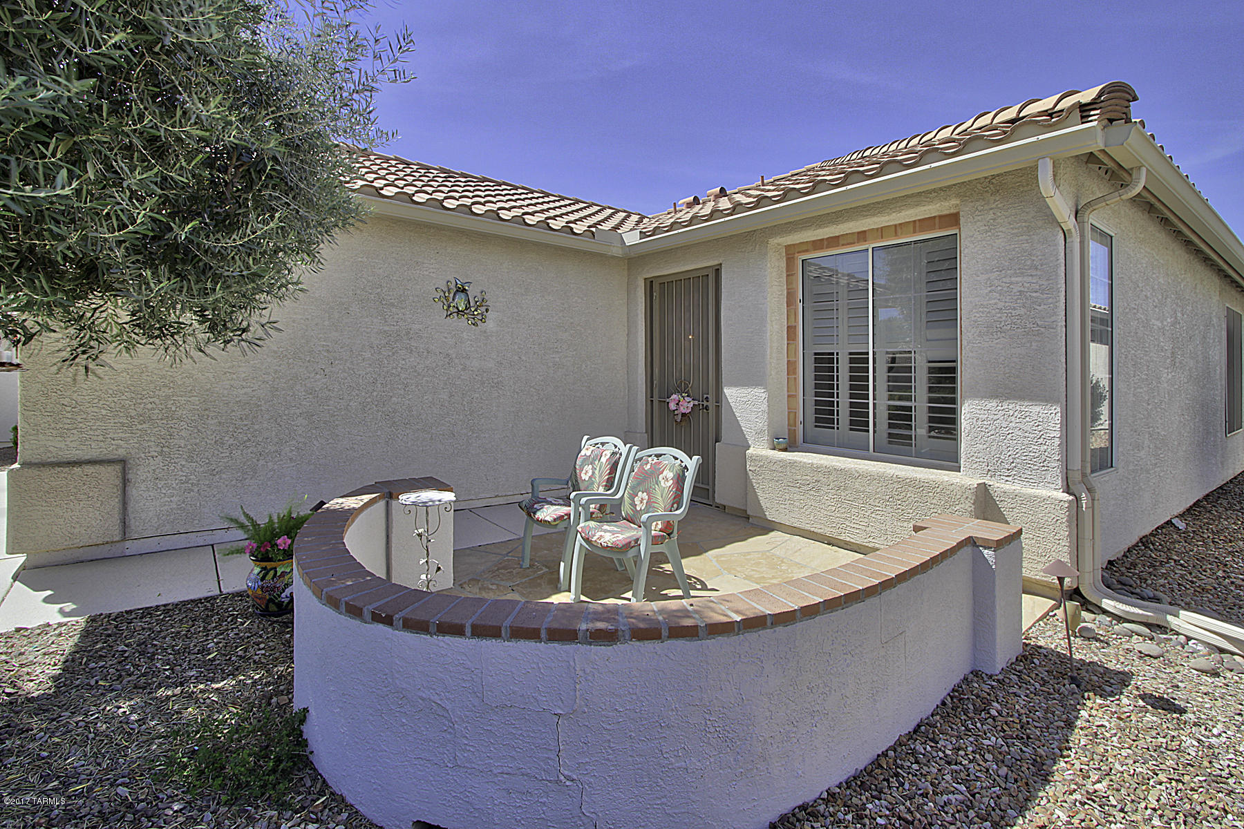 This lovely Sierra model in Fabulous SUNFLOWER  is a TRUE GEM on a large private lot with custom upgraded cabinetry, tile flooring, three patios (one flagstone and one screened in), BBQ fire pit, and nice window coverings.  Garage and driveway are Epoxy coated.  There are 3 gorgeous mature fruit trees in the spacious private back yard. Wonderful flowing floor plan with spacious eat-in kitchen, with nice cabinetry and counter top space, open to very large Great Room with high ceilings. From there flow continues to a screened-in Patio and hence into the wonderful Flagstone BBQ area in spacious back yard. Master Bedroom and 2nd bedroom are large with great closet space. Laundry room with Cabinets between garage and kitchen. +++ All of the great amenities of this Active Adult Community inc.!!