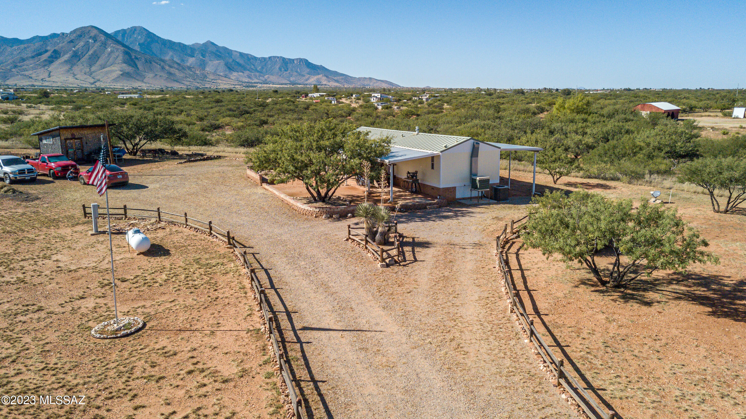 3.99 Acres fully fenced with private well. Panoramic Views, covered porches on the front & back of the home to enjoy. 2 out buildings with gated drive. 2 bedroom 2 bathroom home. If you are looking for a piece of privacy this may be it. Newer Steel Roof.