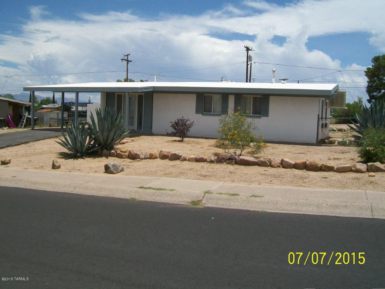 This remodeled, well maintained home has many nice features: Interior block walls have been dry walled, dual pane windows (except kitchen), back covered patio plus a front covered porch, chain link fenced back yard, remodeled kitchen & bath with 4' vanity. Brand new carpet, freshly painted interior. All appliances included, even washer & dryer. Newer furnace, cooling unit & on-demand water heater. Workshop with cabinets is 9'8'' X 12'8''. Interior doors, patio door in dining room & front door (with glass window) are newer. Roof recently re-coated along with resealing of the driveway.