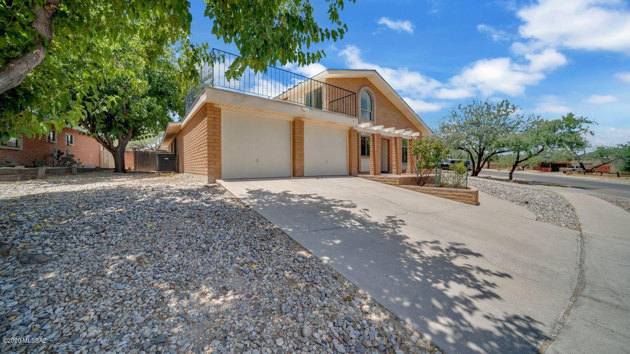 This 2389 SF, 4BR, 2BA home with sparkling pool has been maintained and updated so that all of the major systems; HVAC, solar water heater, pool, roof, dual paned windows are well within their design life. Saltillo tile floors are everywhere downstairs with the only carpet being in the upstairs portion of the two-story master bedroom. There is a large living room with formal dining room and a family room off of the kitchen. The kitchen has been updated with newer cabinets and slate stove, microwave and refrigerator that stays. The deep covered patio leads to the back yard with diving pool and storage shed. Not only are RV's allowed but there's a drive-thru gate and covered parking area for one! The home sits in a great northeast location with schools and shopping nearby. Come see it today.