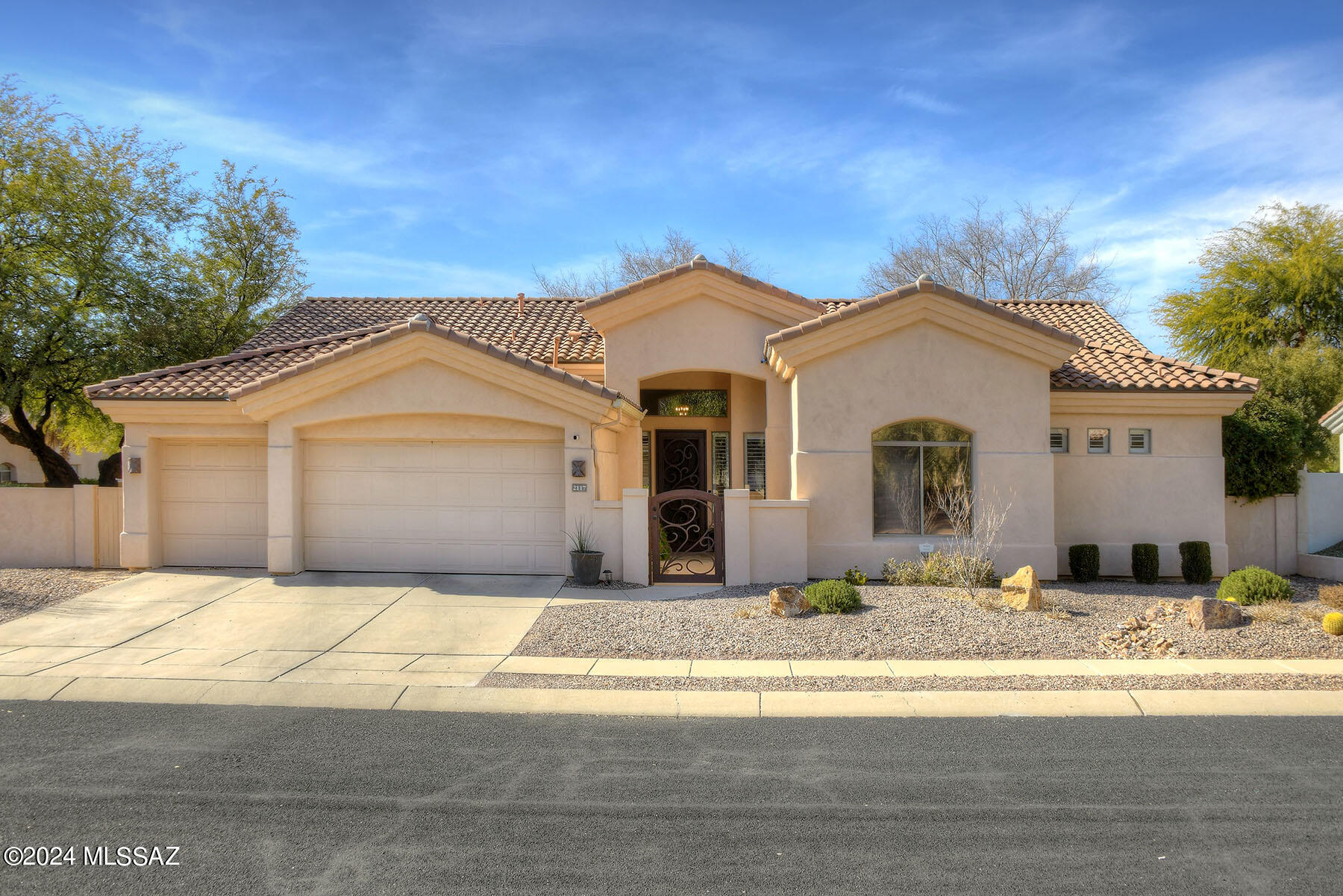 Nestled within the highly sought-after Lakes at Castle Rock GATED Subdivision, this exquisite residence offers a blend of timeless elegance and modern convenience. The  2,905 sf. homes features a thoughtful split-floor plan with 4 bedrooms & 3 bathrooms, providing both privacy & spacious living. Step inside the fully remodeled interior (completed in 2020) featuring stunning 20'' Porcelain Tile Floors throughout, complemented by matching tile baseboards & high ceilings, creating an atmosphere of openness & luxury. The kitchen, a focal point of the home, seamlessly opens to the family room & boasts Chiseled Granite Countertops, Custom Raised Panel Cabinets, & a 4 x 9 Custom Island. Appliances include a 6-Burner Dual Fuel Range/Oven & a Wall Oven & Microwave combination. The stone backsplash and custom lighting add a touch of sophistication. Upon entering the home, you are greeted by an inviting courtyard adorned with a Custom Iron Gate and Security Door. Entertain with ease in the large formal living and dining room, or cozy up by the fireplace with stacked stone in the family room. Custom wood shutters adorn the windows throughout, providing both style and functionality. The separate laundry room, equipped with a refrigerator, cabinets, and countertop, adds a practical touch to daily living.
The primary bedroom, part of the split floor plan, features a spacious layout with 20-inch tile, a huge walk-in closet with mirrored French doors, and a remodeled bathroom (2020). The bathroom is a retreat in itself, featuring a large walk-in shower with dual shower heads and a custom double vanity with granite counters.
Step outside into the backyard oasis, where a covered patio overlooks a large enclosed yard with a block wall for added privacy. The pool, with iron security fencing, a cascading waterfall, and a new pump installed in 2023, creates a serene and refreshing retreat. An above-ground hot tub, artificial grass, an irrigation system, and large shade trees complete the outdoor experience. The spacious entertaining area with a beehive fireplace is perfect for gatherings and relaxation.
The attached 3-car garage not only provides ample parking space but also features custom built-in cabinets and overhanging storage units, adding both organization and functionality.
This home has been meticulously cared for, with over $125,000 invested since 2018, ensuring that it not only meets but exceeds the highest standards of comfort and luxury. With its prime location, thoughtful design, and numerous upgrades, this residence offers a unique opportunity to experience the epitome of gracious living in Castle Rock. Community Amenities Include 14 Lakes, Fitness Center with Heated Pool/Spa, Rec Center with Pool/Spa & Sauna, Tennis Courts, Pickle Ball, Basketball Court & Walking/Jogging Paths.