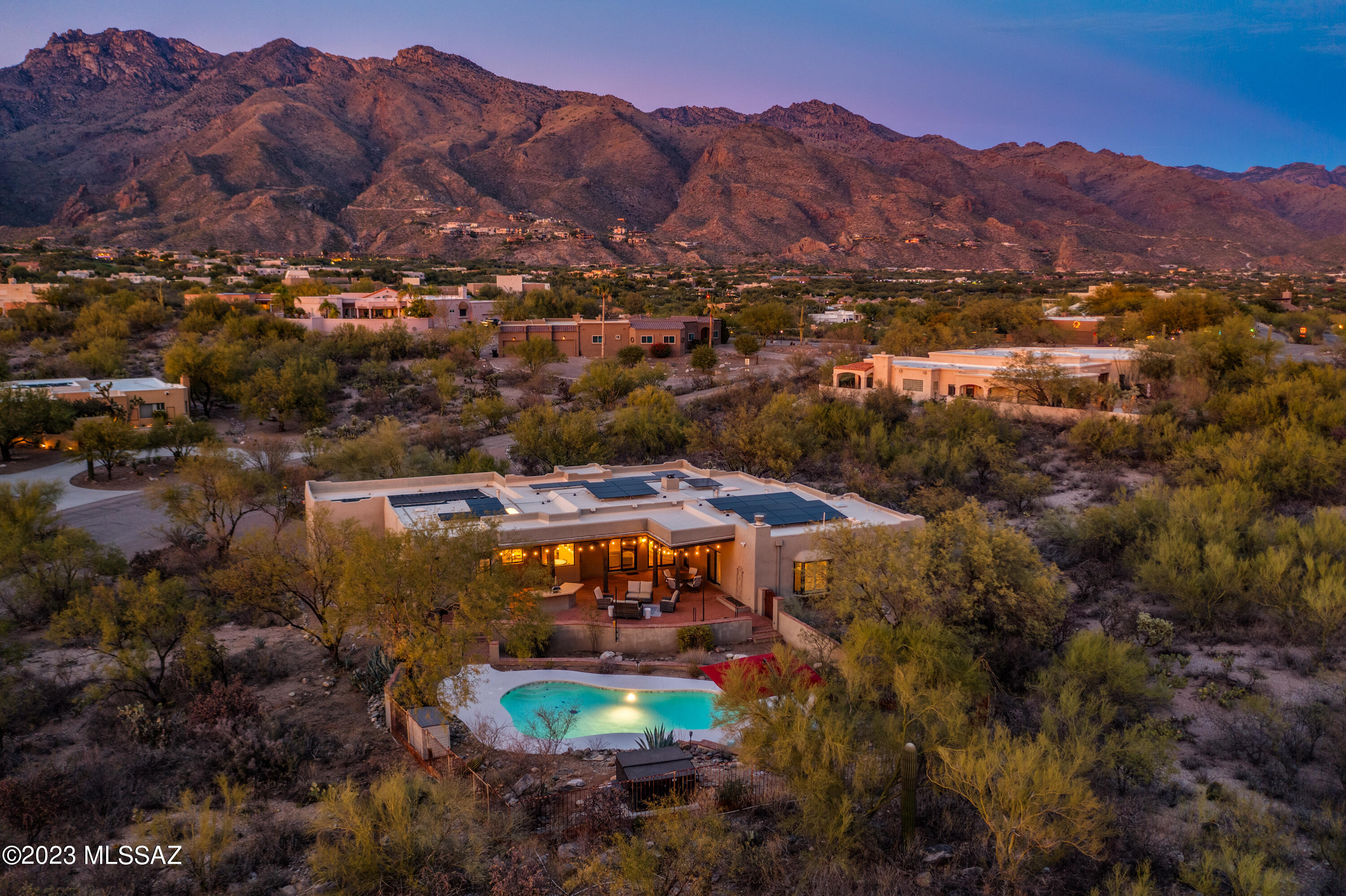 Welcome to this STUNNING, single-level home in the heart of Cimarron Foothills Estates.  Featuring an open floor plan w/soaring ceilings, beautifully updated Kitchen, split plan guest wing and a spacious primary bedroom w/FP & updated en suite! Enter into the lovely foyer, open to the formal Living Room and Dining Room, both boasting of brilliant mountain views!  The generous Family Room features warm beamed ceilings & beehive FP w/custom wood-burning insert.  Updated fans and LED lighting throughout! Venture out back to a private desert oasis w/updated salt-water pool, elevated above-ground spa, built-in BBQ, extended patio & sail shades! Extensive, owned Tesla solar PV system w/TWO Powerwall units!  High tech SPAN elec. panel and car charger!  DISTRICT 16 SCHOOLS! AMAZING LOCATION! Recent Upgrades Include: 
Solar/PV - 13.2KW (33x400W panels), 
TWO Tesla Powerwall Plus Energy Storage Devices,
Solar pool heater,
Span smart electrical panel,
Span electric car charger,
Wood burning insert,
Hot tub + hillside install + paving,
Resurfaced/retiled Pool,
Salt water pool chlorinator, 
Custom window sun shades, 
Shade sail + posts,
Redecorated most rooms,
Kitchen upgrade - New countertops, sink, backsplash, dual-zoned, beverage cooler,  
Replaced fans throughout,
Replace all lights with LED and Hue bulbs,
Replaced flooring in dining room,
Replaced flooring in front living room,
Replaced sink in laundry.
