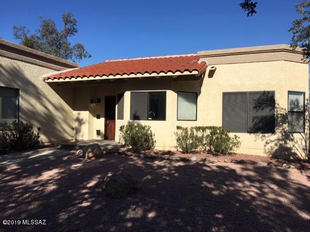 MUST SEE!!  Private location in small 48 lot gated community. Bright open floor plan with oversized bedrooms and walk in closets. Remodeled bathrooms with all new fixtures,marble vanity countertops and new tile in shower surrounds.  All new kitchen appliances in stainless steel.  New A/C in 2016, new paint inside and new roof coating.  Fantastic view of the Catalina Mountains from wrap around brick patio and separate covered porch.