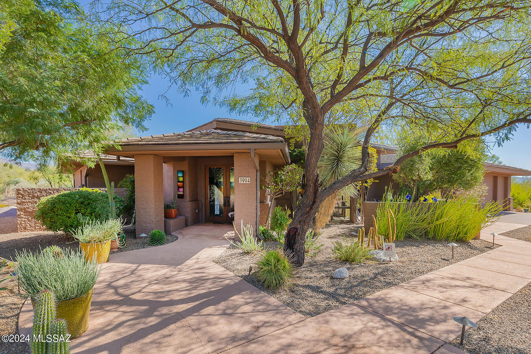 Superb Canyon Ranch beauty. 2 Luxurious bedrooms plus office. Enjoy the three outdoor spaces; back patio with fireplace,, front patio dining, sweet sanctuary off the primary bedroom. hand textured Venetian plaster faux finishings along with special lighting creates a warm & inviting atmosphere. 2 mile loop is just steps away. Live your best life at the 200 acre campus of Canyon Ranch with access to a variety of fitness classes, lectures, tennis, oickleball, multiple pools. Treat yourself to a lifestyle and home you can start enjoying on your first day as a Canyon Ranch homeowner.