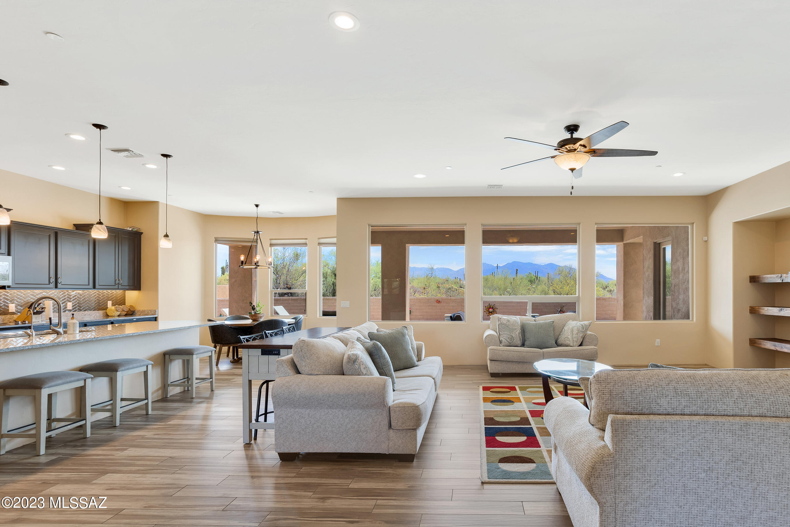 Beautiful 2019 custom home on an acre. Enjoy magnificent mountain views. This home features an open floor plan with high ceilings and walls of windows. Tucked into a private enclave surrounded by natural desert with your very own saguaros. Spacious kitchen offers plenty of cabinets and counter space plus a huge center island. The primary suite is a cozy retreat with a huge walk-in closet. The en-suite bathroom features a double vanity, a fantastic walk-in shower & soaking tub. Jack and Jill bathroom between bedrooms 3 & 4. Split bedroom floor plan. Custom window coverings. You'll love the backyard with covered patio, lush artificial turf lawn, 2022 installed Pebble Tec salt pool (with occasional chlorine supplement) . The pool chlorinator level & lights are controlled by phone app. Conveniently located to Twin Peaks/I-10. Several warranties convey with home: roof materials warranty, water treatment system warranty, pool equipment warranty.  Located in Marana Unified School District, state-of-the-art, Dove Mountain CSTEM K-8 school.