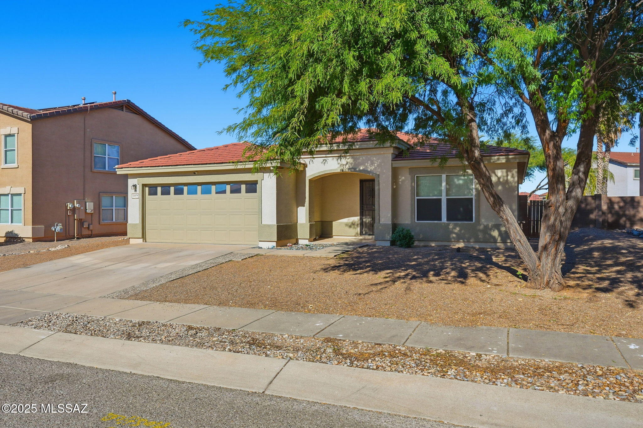 This beautifully maintained home features an open floorplan with 3 bedrooms, 2 updated bathrooms, plus a den-perfect for an office or guest room! Enjoy energy efficiency with fully PAID OFF solar system and modern finishes throughout, including LVP flooring and fresh interior paint. The spacious kitchen offers stainless appliances, and ample counter space for cooking and entertaining. The primary suite includes a stunning tiled shower and soaking tub, creating a true retreat. The spacious backyard includes a relaxing covered patio. Located in the award-winning Vail School District, this home checks all the boxes for comfort, convenience and affordability! Come make this house, your new home!