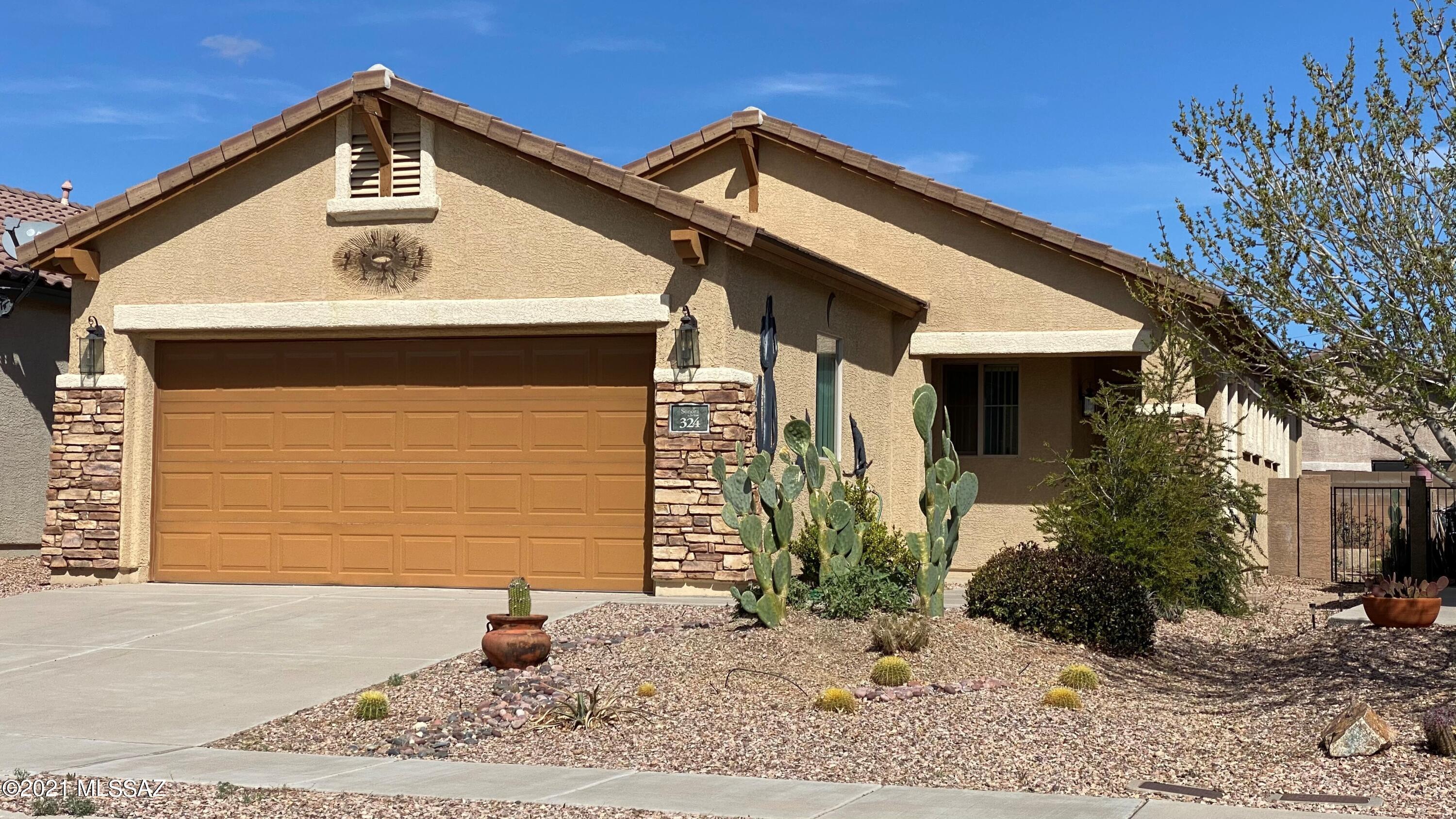 Enjoy active adult living in this Del Webb 55+ community in the heart of Rancho Sahuarita. This Mescal 1,256 sq.ft. floor plan offers 3 bedrooms and 2 bathrooms. Some of the features this property include an open great room concept, bay window in owners suite with executive height, dual sink vanity, Soft water system, washer & dryer along with newer kitchen appliances. The covered patio is pre-wired with a paradise-like backyard and extended paver patio and raised flower beds to enjoy year round blossoms. Owners would like to sell the property furnished with a separate BOS. Access to two gyms, 5 swimming pools, walking and biking trails & so much more! This place is turn key and ready to close. Be sure to see the Virtual Tour.