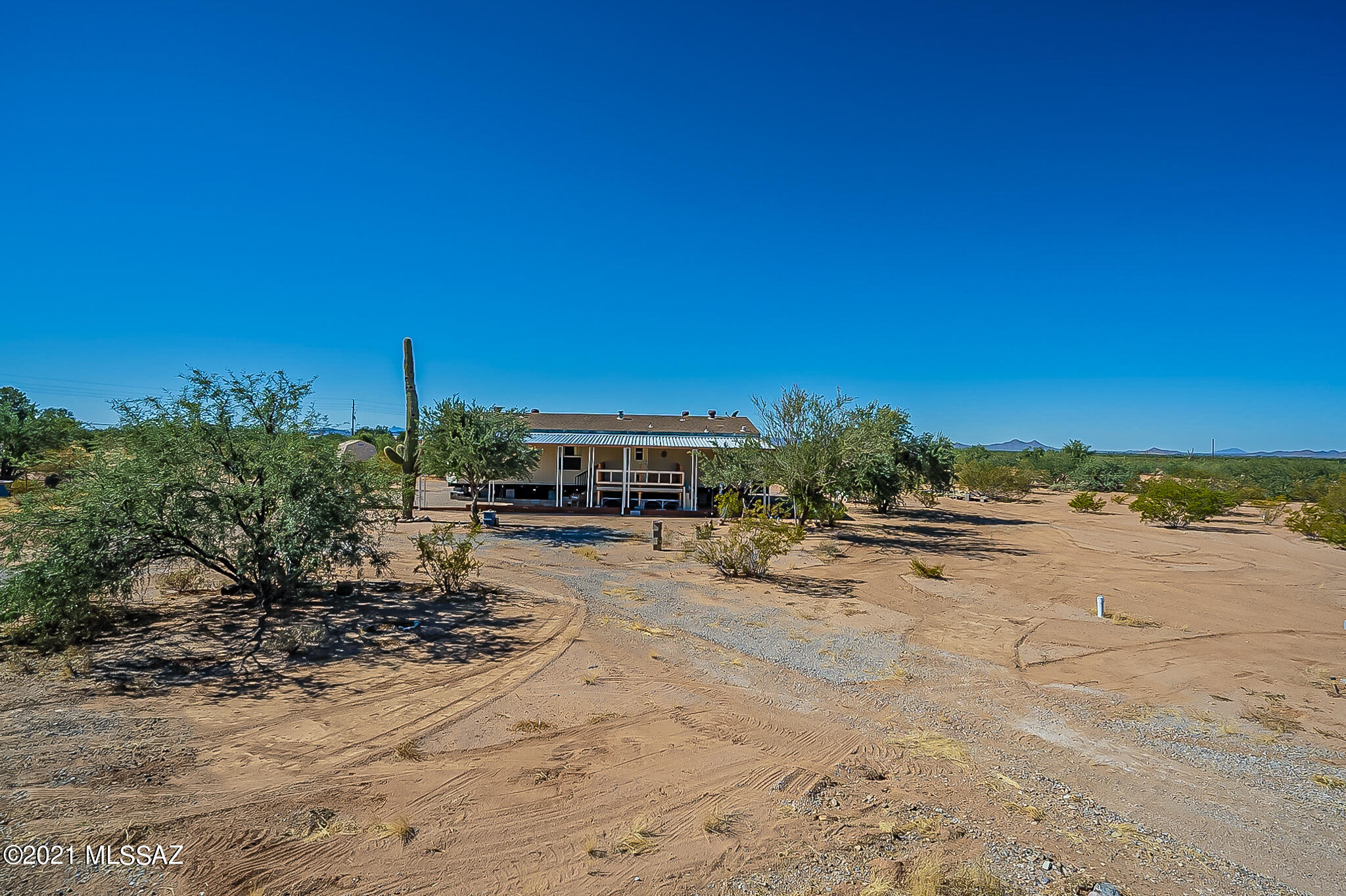 Peace and mountain views on over 8 acres of gorgeous land that was homesteaded in 1885. This property was developed with the intention of possibly having four homes. There is 2 separate entrances and 2 septics. The main water line was strategically placed by the original owner in the middle of the property for multiple homes. The property has 4 RV hookups that rent out for $600+ each for income. 2 RV spaces are rented until April for $500 per month. You can live in the clean, move in ready home, while building your dream house. Or add a second manufactured home for extended family home. The possibilities are endless.Come see this one today!