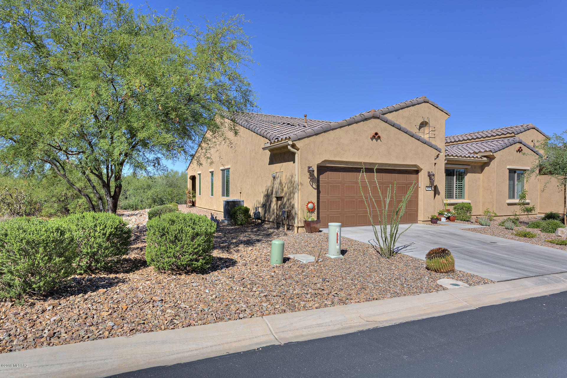 UNOBSTRUCTED MOUNTAIN VIEWS AND TOTAL PRIVACY IN THIS THE LARGEST OF THE VILLA MODELS. One of the best Villa premium lots in Quail Creek, with incredible common area on one side. Beautifully upgraded with granite counter tops, stainless steel appliances, neutral tile throughout, custom his/her office with pocket doors (gorgeous), upgraded lighting package and much more. NO yard work or outside maintenance, just enjoy the lifestyle of this beautiful home and community.