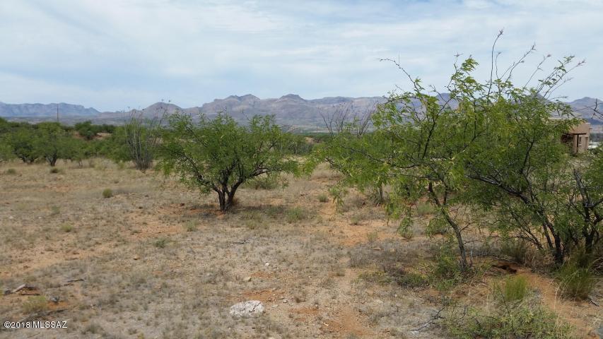 Residential lot very flat and all usable.  Cul-de-sac lot with few neighbors.  Road is dirt but well maintained.  Mountain views.  Electricity and water appear to be there but water should be verified during inspection period.