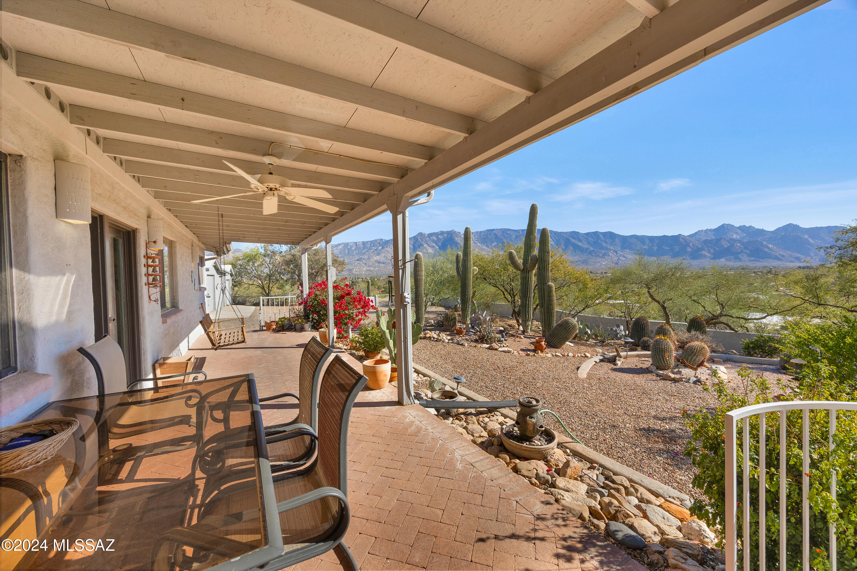 Sweeping Catalina Mountain Views! Perched high on a hill this 1548 sq ft, slump block home has 2 bedrooms and 2 baths, an open concept, separate office/den and a covered porch to enjoy the fabulous sunsets each evening. Master bedroom has a walk-in closet and its own ensuite. An electric gate opens to the 1+ acre property which also has a 3 car garage with space for a sizable workshop. $$ Bonus!, there is an AT&T wireless antenna on the property with a perpetual lease that brings in $661.25 each month for the owner of the property. Hot tub conveys ''as is''. This is a must see home with privacy and unlimited views.