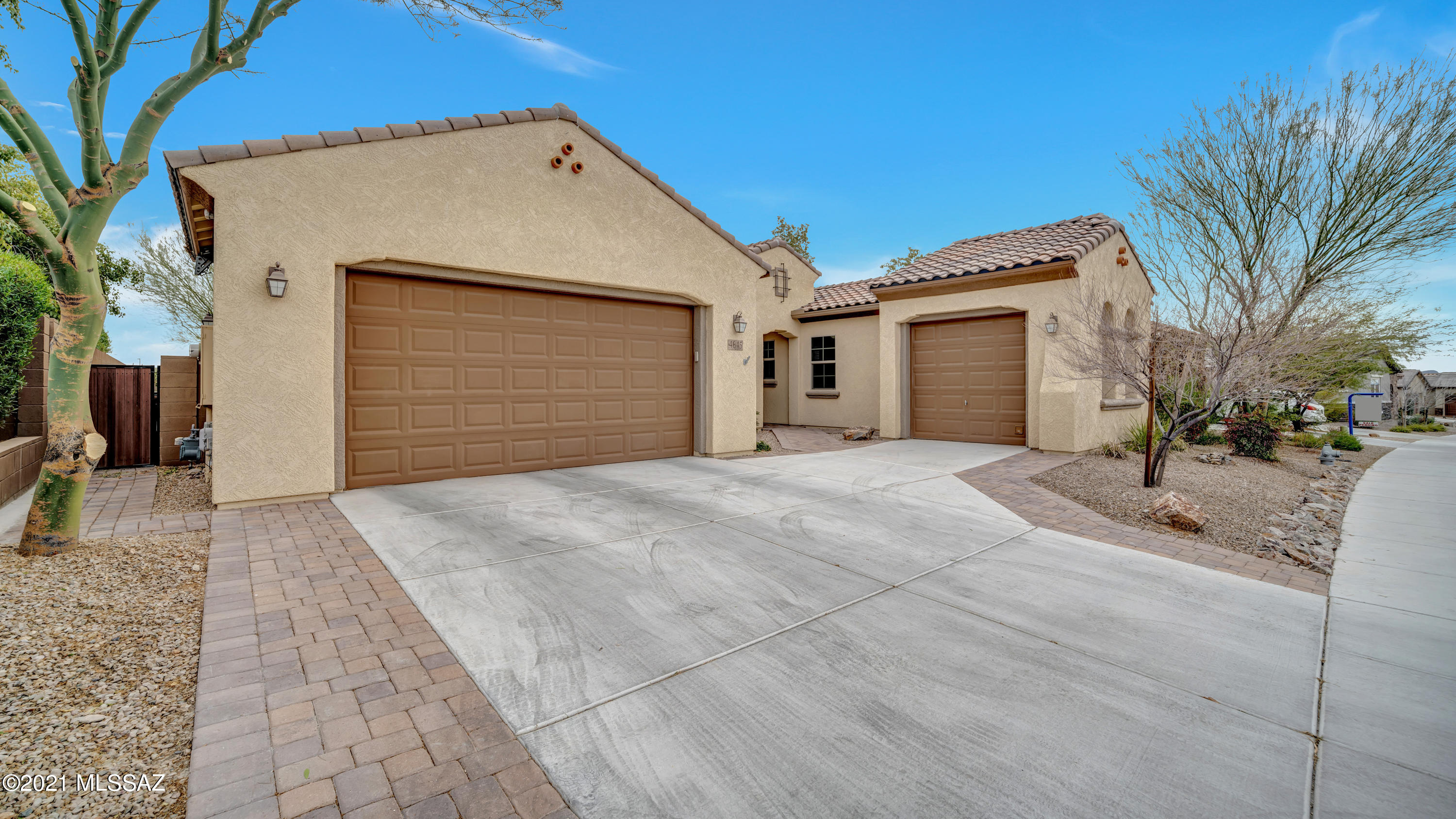 Former model home with more than $80K of upgrades when built. Owner of just two years has tastefully painted most rooms for a fresh look. Stunning lot with direct views of the mountains, backs to expansive common area. A local small regional park is just outside the subdivision entrance with dog parks, play area and walking paths. This sought after open and bright floor plan is accented with high ceilings and walls of windows. The gourmet kitchen includes upgraded raised panel wood cabinets, granite counters, stainless steel appliances, gas cooktop, and a huge walk-in pantry. The private den/office is perfect for working from home or home schooling. Rear yard has a faux grass putting green, substantial aluminum pergola to sit under and view the natural desert and mountains. All appl. stay.