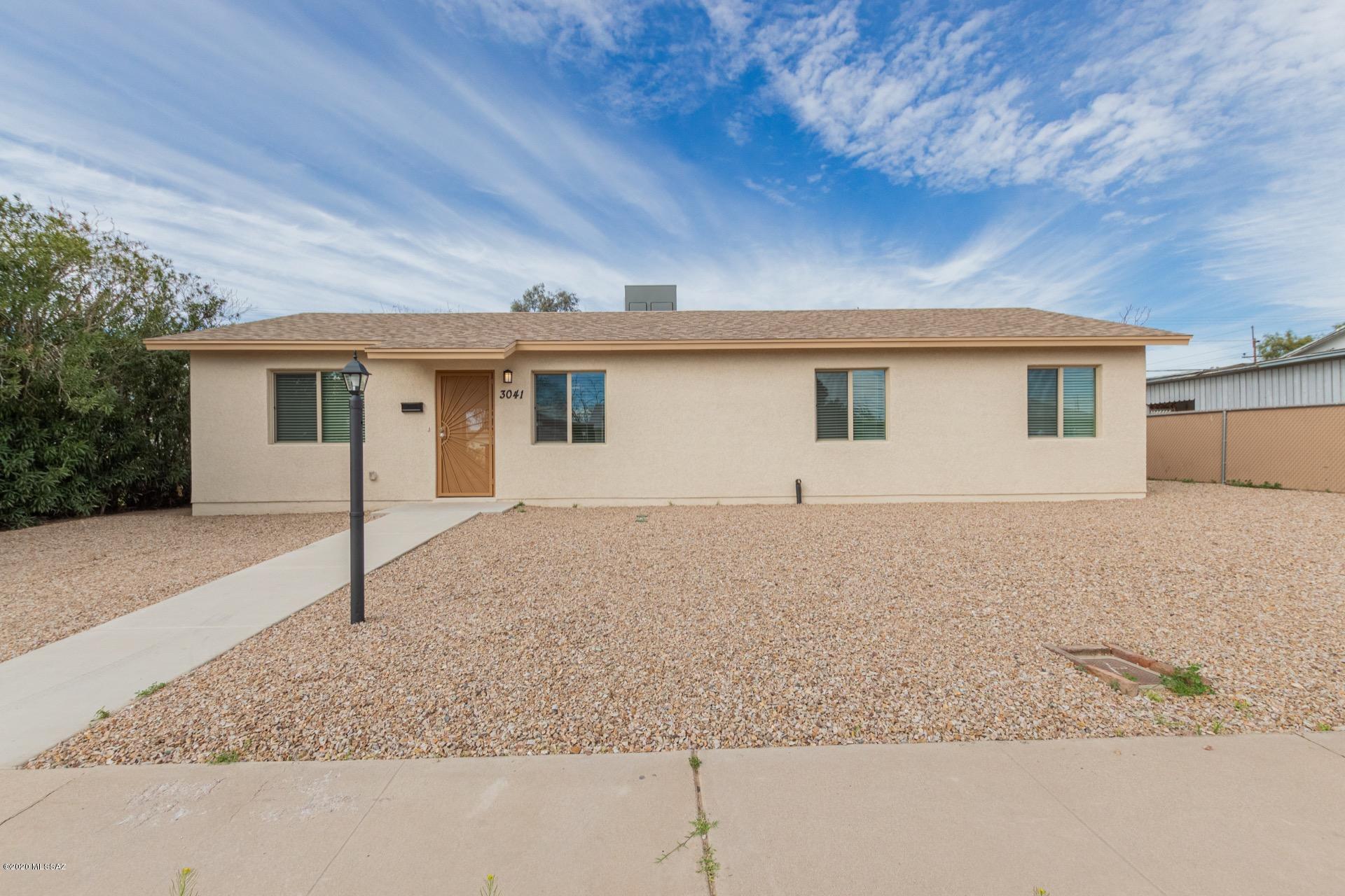 Beautiful energy efficient renovated single family home, move in ready, open floor plan with 4 bedrooms and 2 bathrooms. Kitchen complete with all new Whirlpool appliances, granite countertops, big island with built-in USB charging outlets, designer white cabinets, brushed nickel hardware, LED lighting throughout and a separate laundry room for additional storage. Stunning plank tile flooring throughout the living area and bathrooms with durable Berber Carpet in the 4 bedrooms. Designer Accented tile surrounds the showers and tub. Maintenance-free front yard landscaping. Large fully fenced backyard with mature landscaping and vehicle entrance from the front and/or the rear of the home and a lovely covered patio for entertaining. This home is conveniently located within minutes of I-10, I-19, Palo Verde Parkway, Kino Parkway, Tucson International Airport, Kino Sports Complex, Kino Event Center, FC Tucson Soccer Stadium, Banner University of Arizona Hospital, University of Arizona Tech Center, University of Arizona, Davis Monthan AFB, Downtown Tucson, and walk to Sam Lena Park & Walking/Biking Paths (softball fields, covered Ramada's, shaded children's playground, basketball court, restrooms, and more). Bathrooms equipped with Low-Flow Water Conserving Toilets and faucets, energy efficient Rheem heating and cooling, energy efficient Rheem Water Heater, new interior and underground Plumbing, all new Electrical with a 200 amp service and GFCI outlets, Energy Efficient Dual Pane Low E Windows, Certified R38 and R15 Insulation in the ceilings and walls, Cordless Faux Wood Blinds, rooms pre-wired for TV, Internet, Cable, Bedrooms pre-wired for ceiling fans. Home is 95% Brand New!