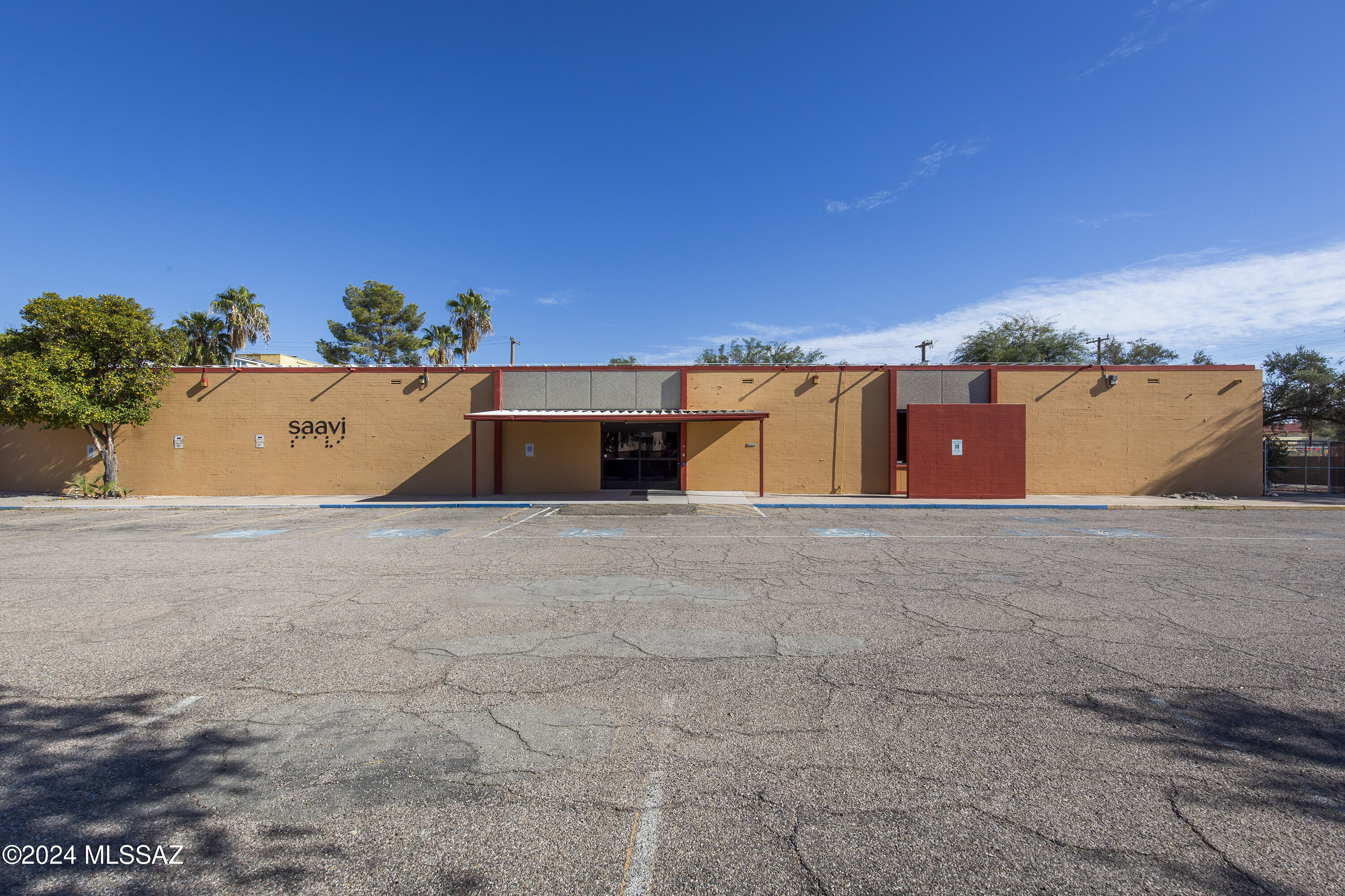 Centrally located former Southern Arizona Assoc for the Visually Impaired headquarters and training center.  This prime property offers approximately 2 acres of land, with the main building of 12,483 sf, plus two additional buildings of 2376 sf and 1536 sf. It features a fully fenced perimeter, ample parking, multiple offices, conference room, training rooms, classrooms, three kitchens, ADA restrooms, a lovely patio and room for expansion. It presents an excellent redevelopment opportunity for various uses, including schools, daycare centers, churches, behavioral health facility and more.