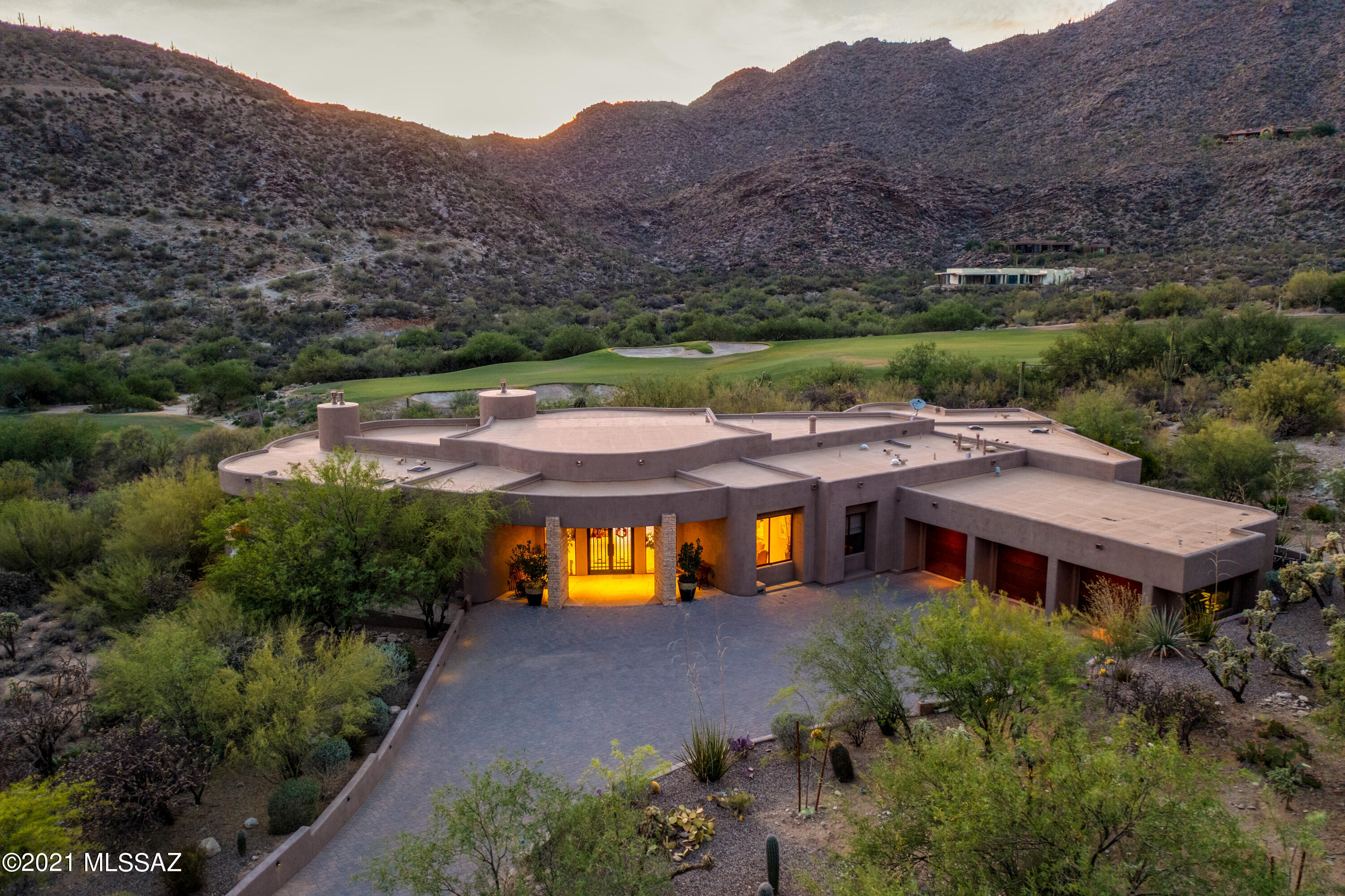 An exquisite Kevin Howard Architect designed home  with views of The Gallery Golf course located inside guard-gated Canyon Pass and gated Vaquero Gallery. Liz Ryan Interiors. Arizona Desgin Kitchen cabinets.   Elan digital control system home. 15 TV's (1-80'', 1-70'', 2Built-In 47'', 1 Built-In patio Sunbright 47'' to mention a few of the specialty ones).  Custom 18x24 Sabbia Limestone floors. Soft water system for bathrooms. Pools by Design salt water pool and spa with LED lighting and torch flares. Great room has spectacular linear fireplace, 7.1 SS system with 3 TV's and a 24 ft curved motorized panel door.  Two masters both have Toto Neorest toilets, full spas, TV and dressing table.  Kitchen hosts all high end appliances.  This is a full high-tech electronic 5100 sf home.