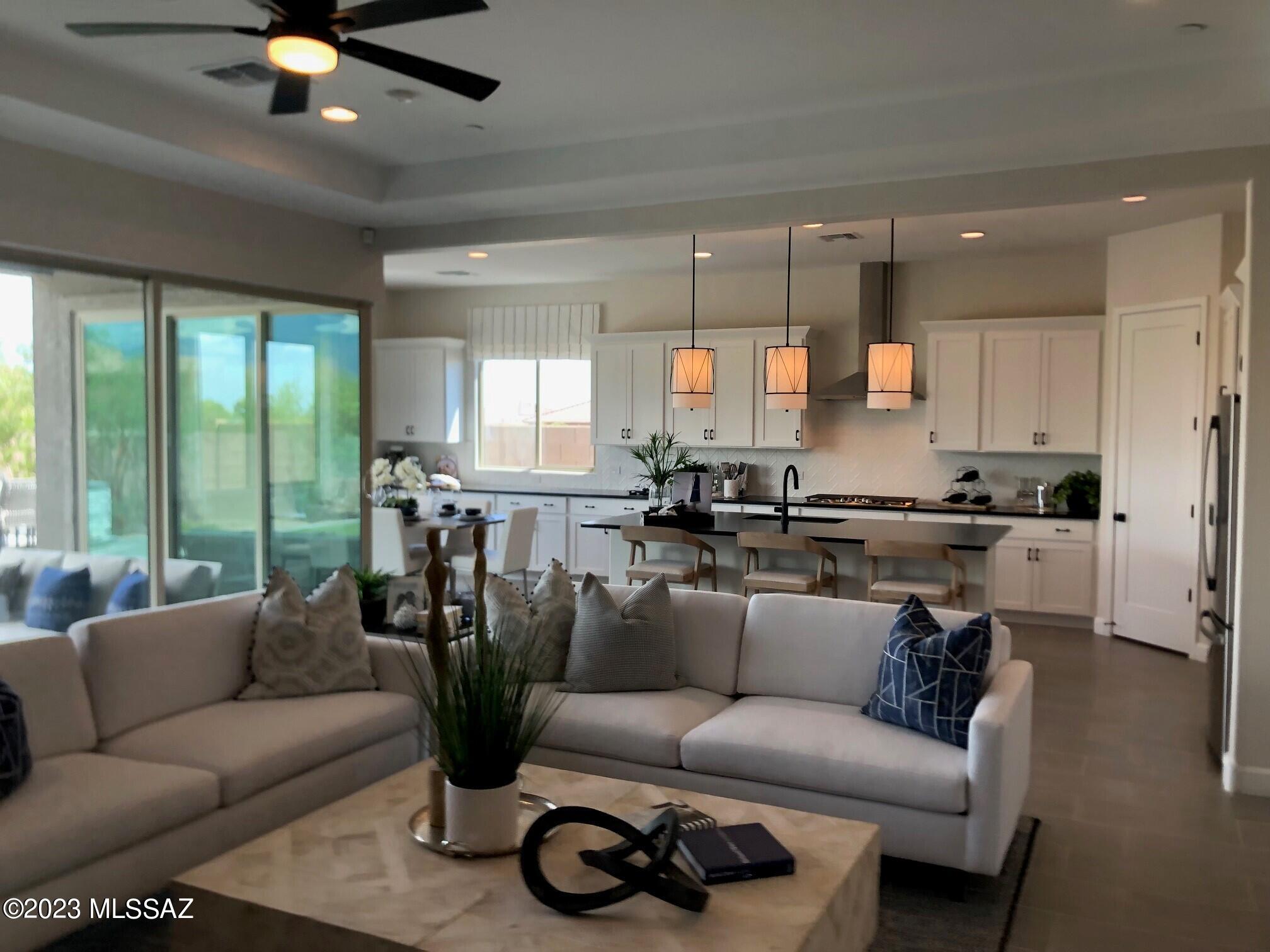 Explore this must-see Pomona model home! Included features: a central study; a spacious great room; a gourmet kitchen with white cabinets, quartz countertops, a center island, a walk-in pantry and slate appliances; a lavish owner's suite offering a walk-in closet and a deluxe bath with quartz countertops and a walk-in shower; a guest suite boasting a living area and a kitchenette; a covered patio and a convenient laundry room. This home also offers a shared bath with double sinks, a 2-car front-entry garage and a 1-car side-entry garage. This could be your dream home!